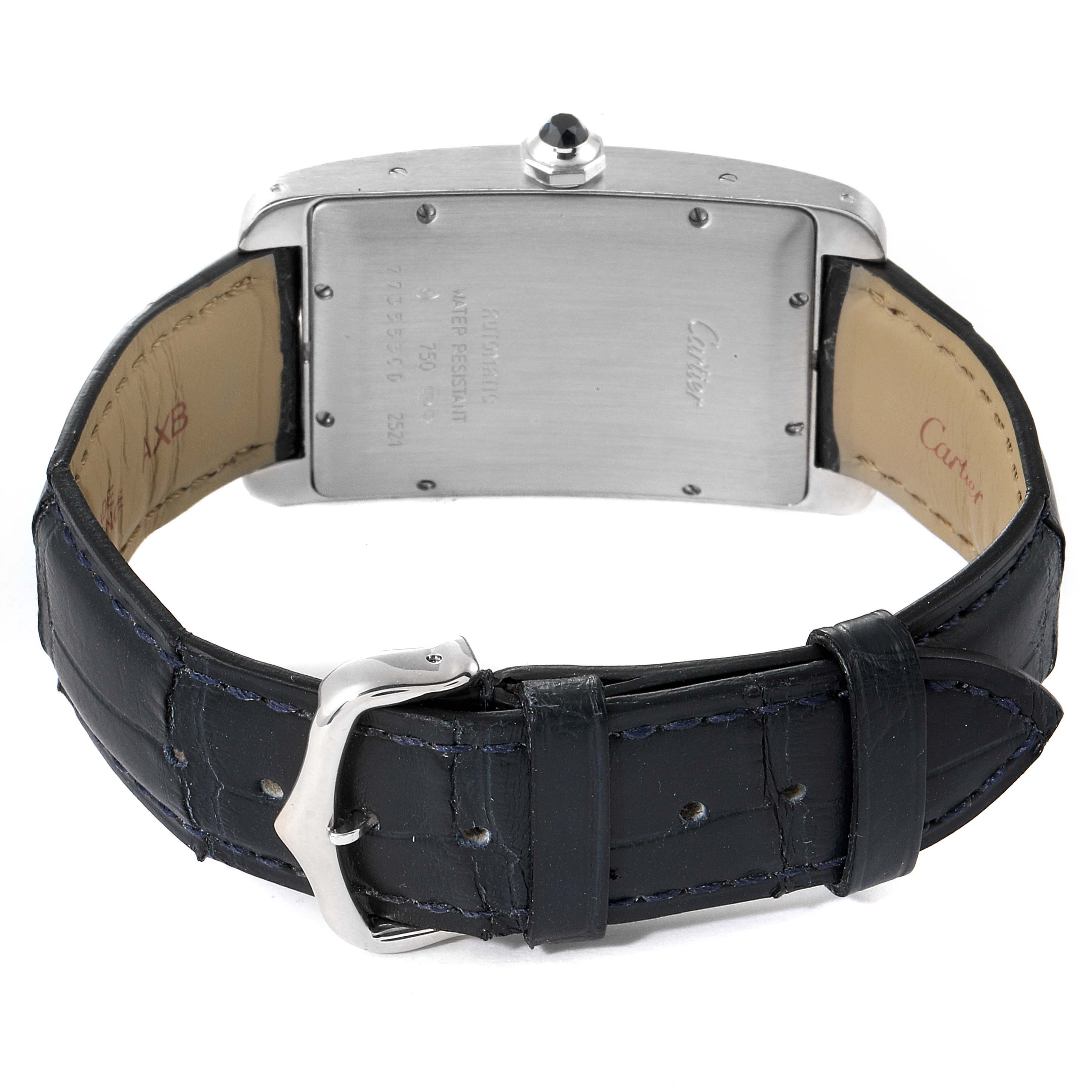 The image shows the back of a Cartier Tank Americaine W2603256 Men's White Gold Silver Dial W2603256 Men's White Gold Silver Dial watch, displaying the case back, serial numbers, and the leather strap with the buckle.