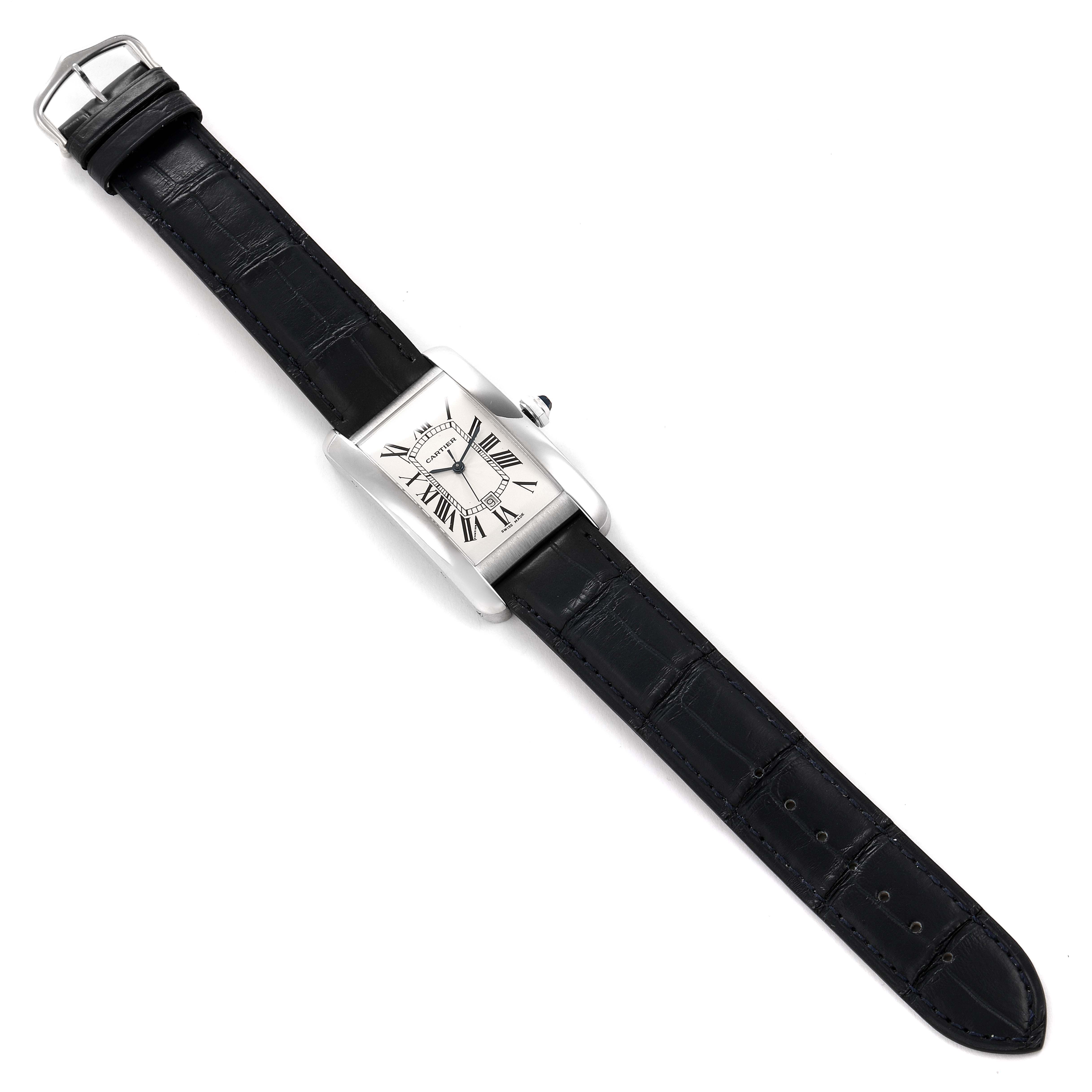 The Cartier Tank Americaine W2603256 Men's White Gold Silver Dial W2603256 Men's White Gold Silver Dial watch is shown from a top-down angle, displaying its rectangular face and black leather strap.