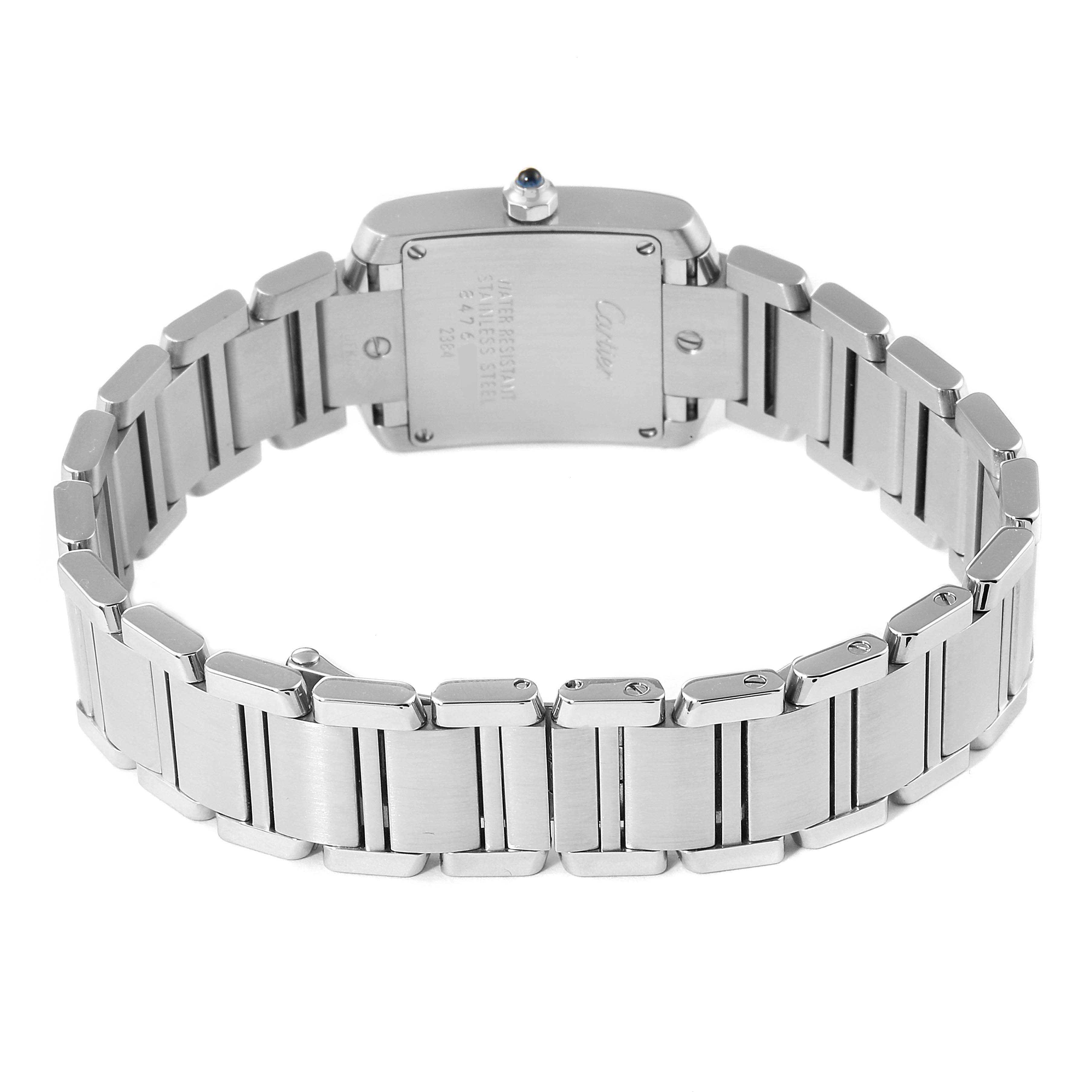 This image shows the back view of the Cartier Tank Française watch, highlighting the stainless steel bracelet and case back.