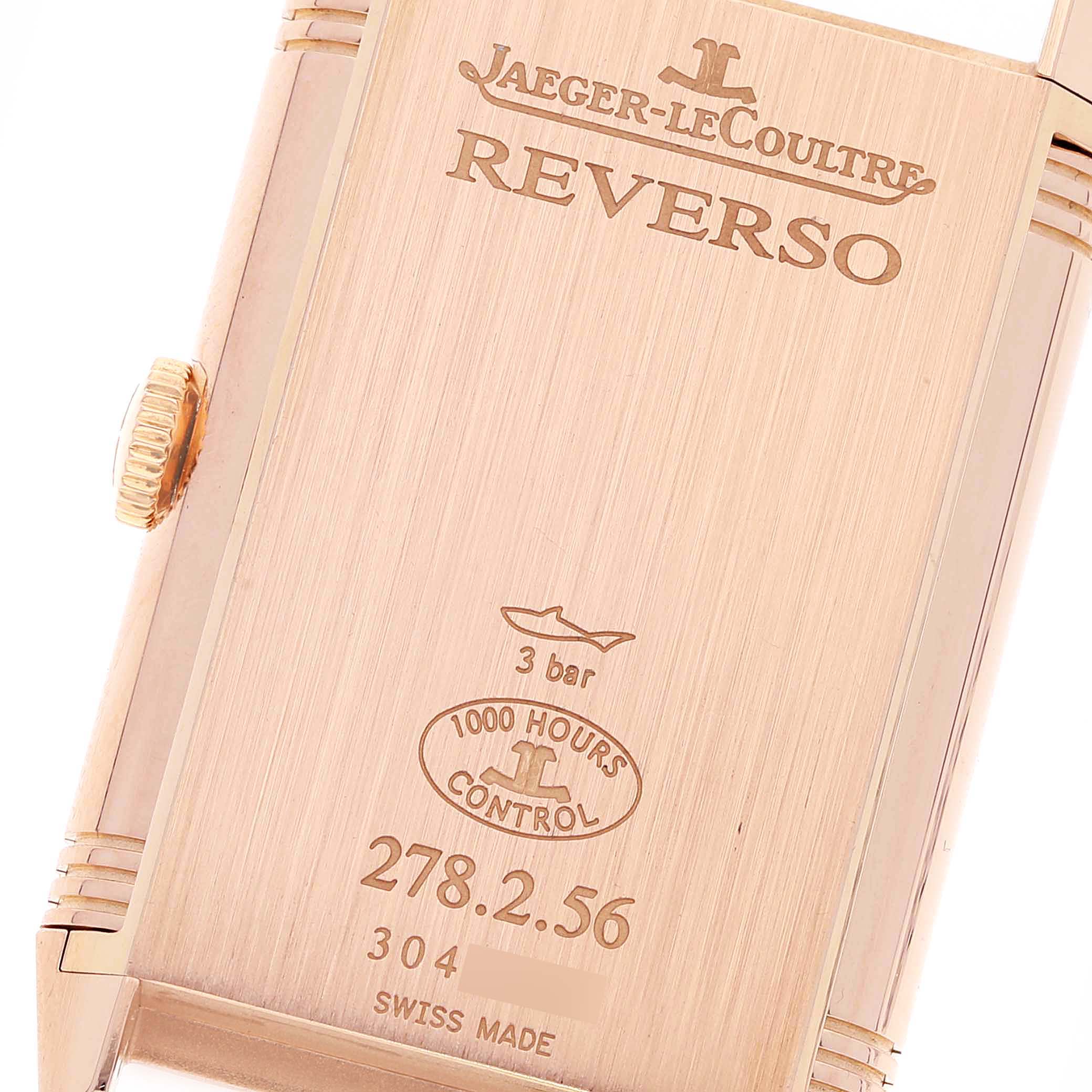 This close-up image shows the case back and crown of the Jaeger-LeCoultre Reverso watch.