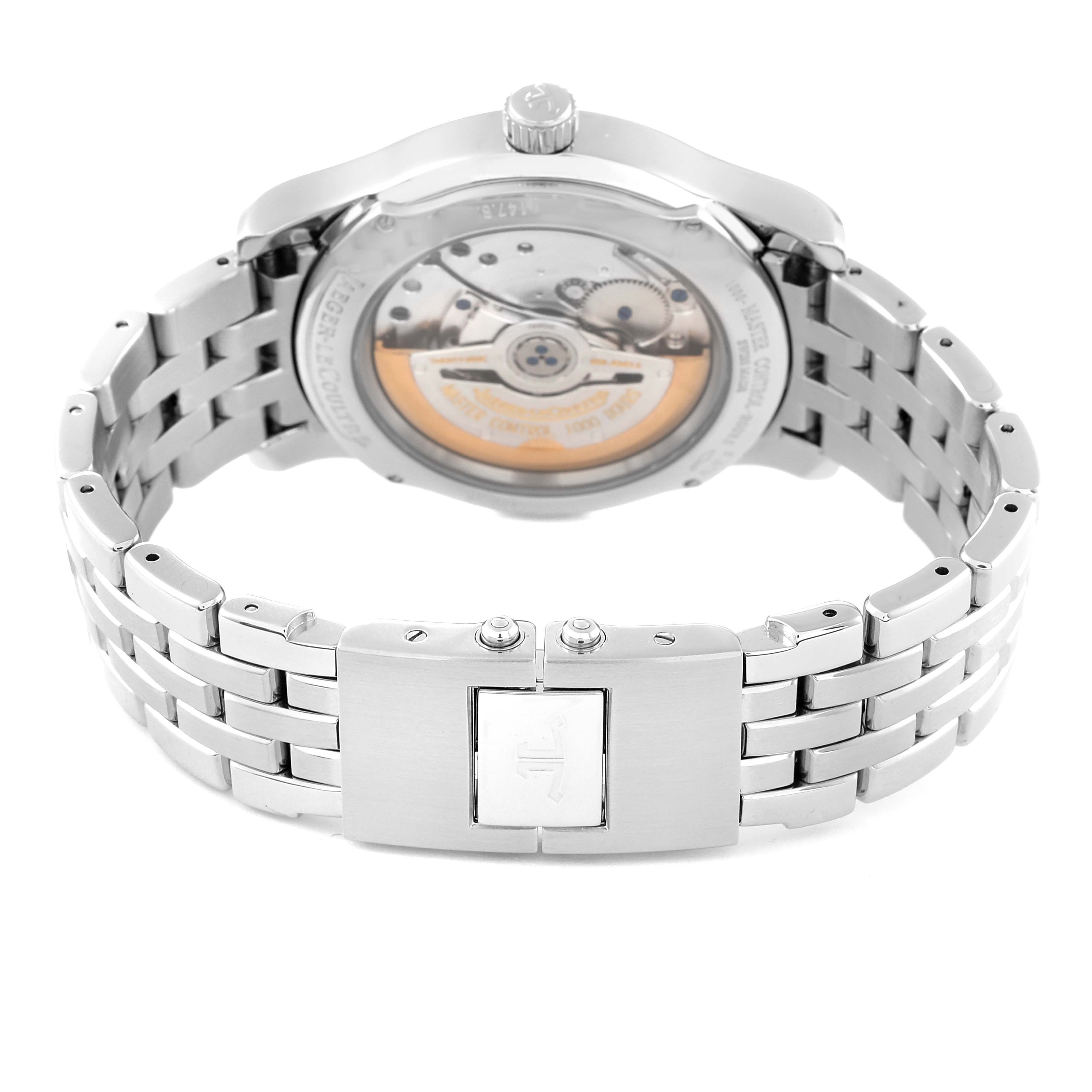 The image shows the back view of a Jaeger-LeCoultre Master model watch, featuring the movement mechanism and stainless steel bracelet.