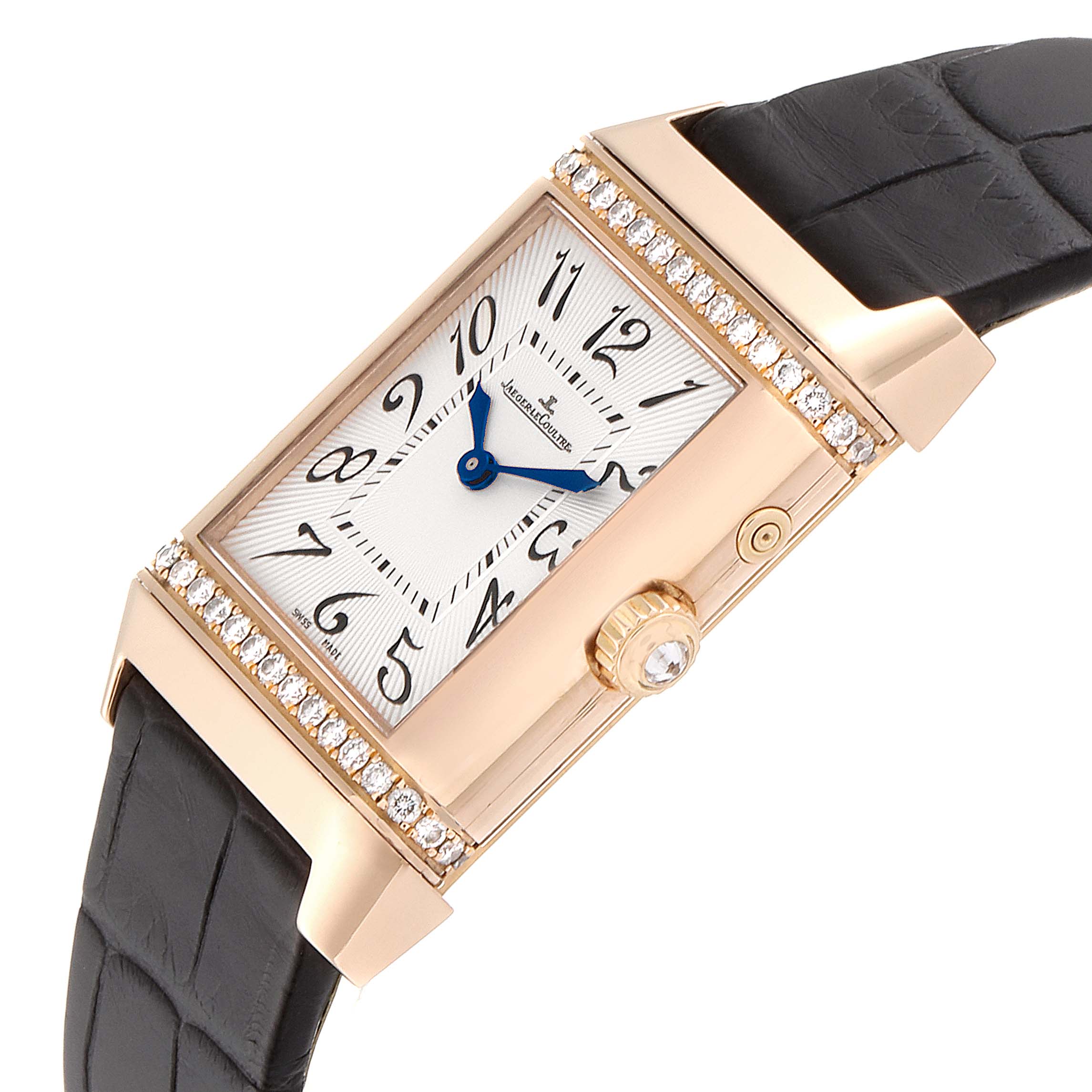 This image shows a Jaeger LeCoultre Reverso Q2692420 Women's Rose Gold Silver Dial Q2692420 Women's Rose Gold Silver Dial watch angled for a closer view of its rectangular face, side crown, and leather strap.
