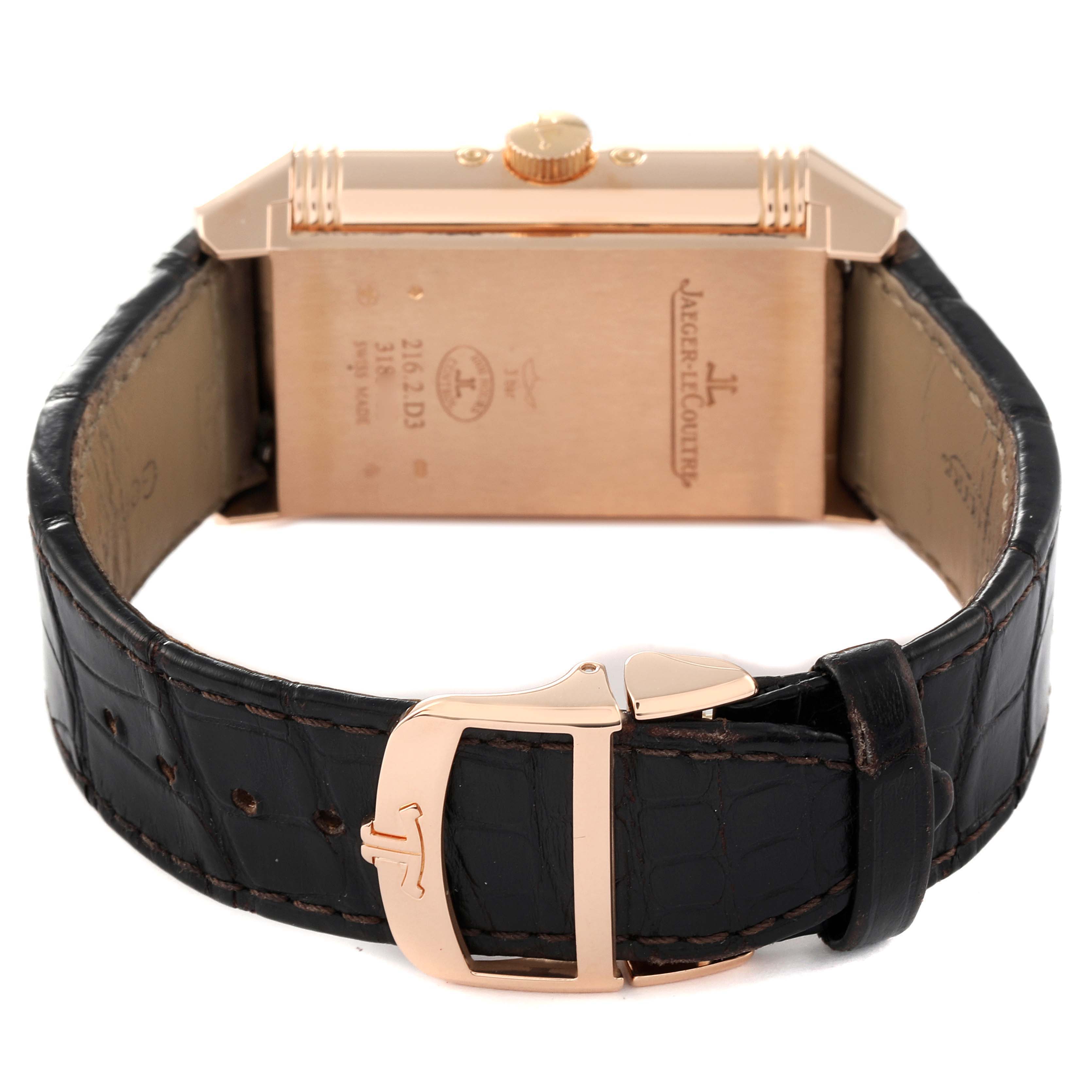 This image shows the back view of a Jaeger LeCoultre Reverso Q3912420 Men's Rose Gold Silver Dial Q3912420 Men's Rose Gold Silver Dial watch, highlighting its clasp and leather strap.