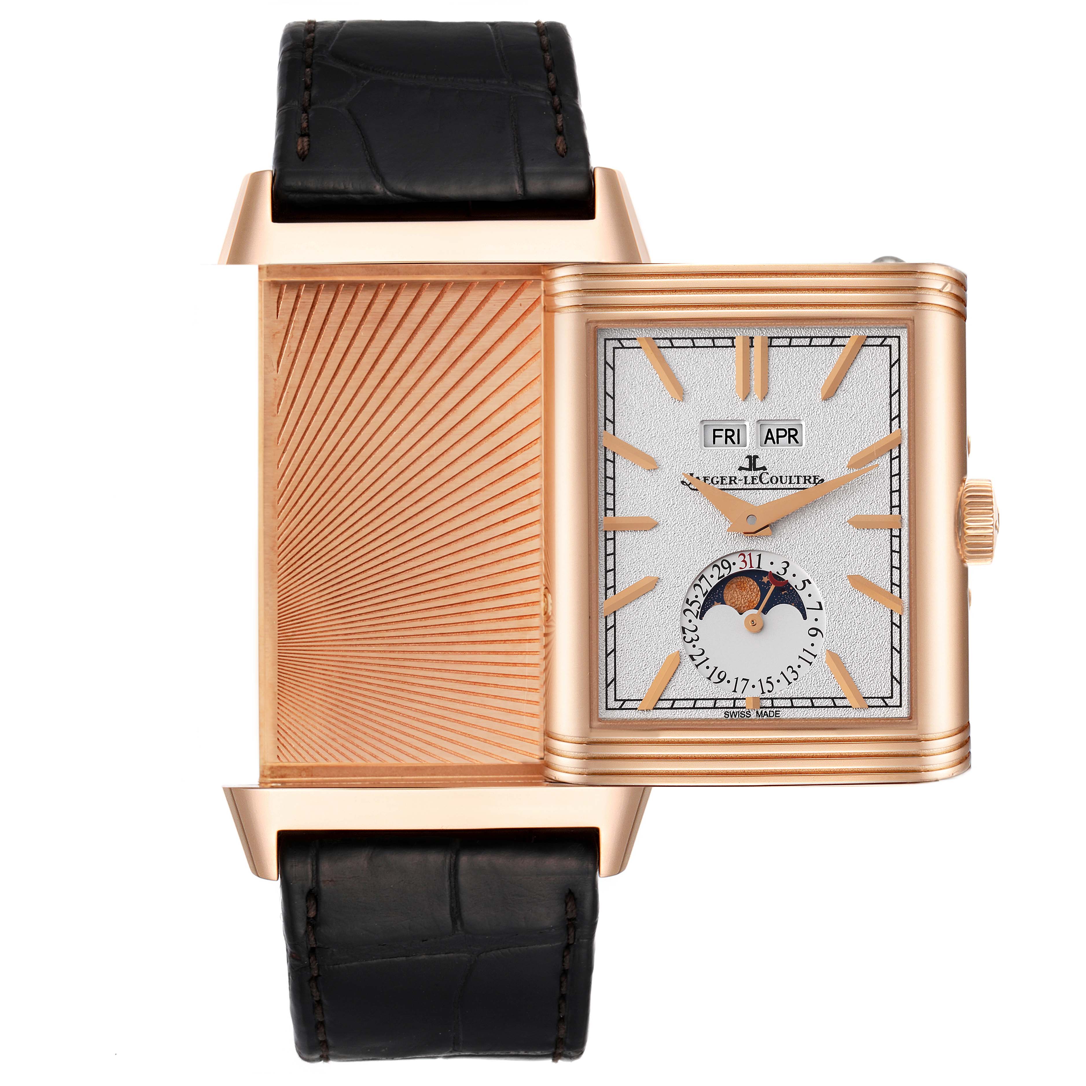 The image shows a Jaeger LeCoultre Reverso Q3912420 Men's Rose Gold Silver Dial Q3912420 Men's Rose Gold Silver Dial watch at a frontal angle, displaying its reversible case and detailed face with day, date, and moon phase indicators.