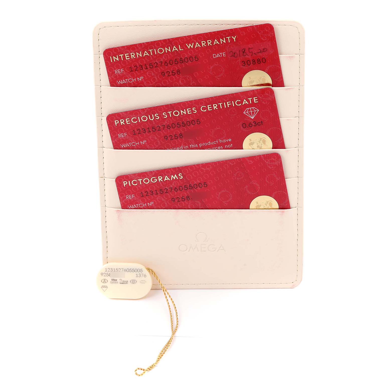 This image shows the international warranty, precious stones certificate, and pictograms cards, along with a tag for the Omega 123.15.27.60.55.006 Women's Stainless Steel Mother of Pearl Dial 123.15.27.60.55.006 Women's Stainless Steel Mother of Pearl Dial Constellation Quartz 27 MOP Diamond Watch 123.15.27.60.55.006.