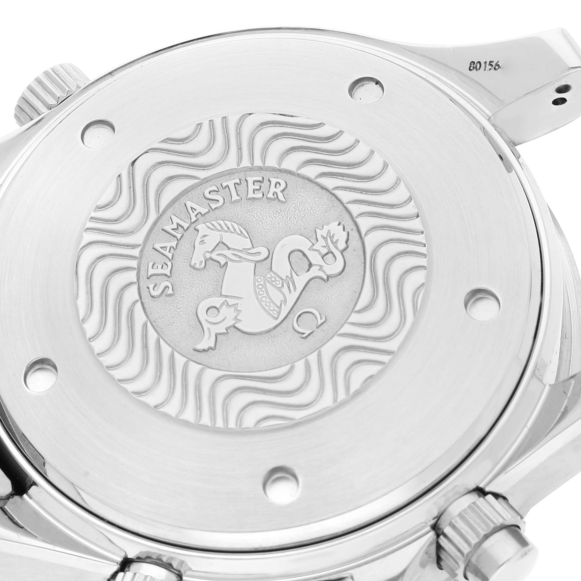 The image shows the back case of the Omega Seamaster 2599.80.00 Men's Stainless Steel Blue Dial 2599.80.00 Men's Stainless Steel Blue Dial watch with an embossed design and crown.