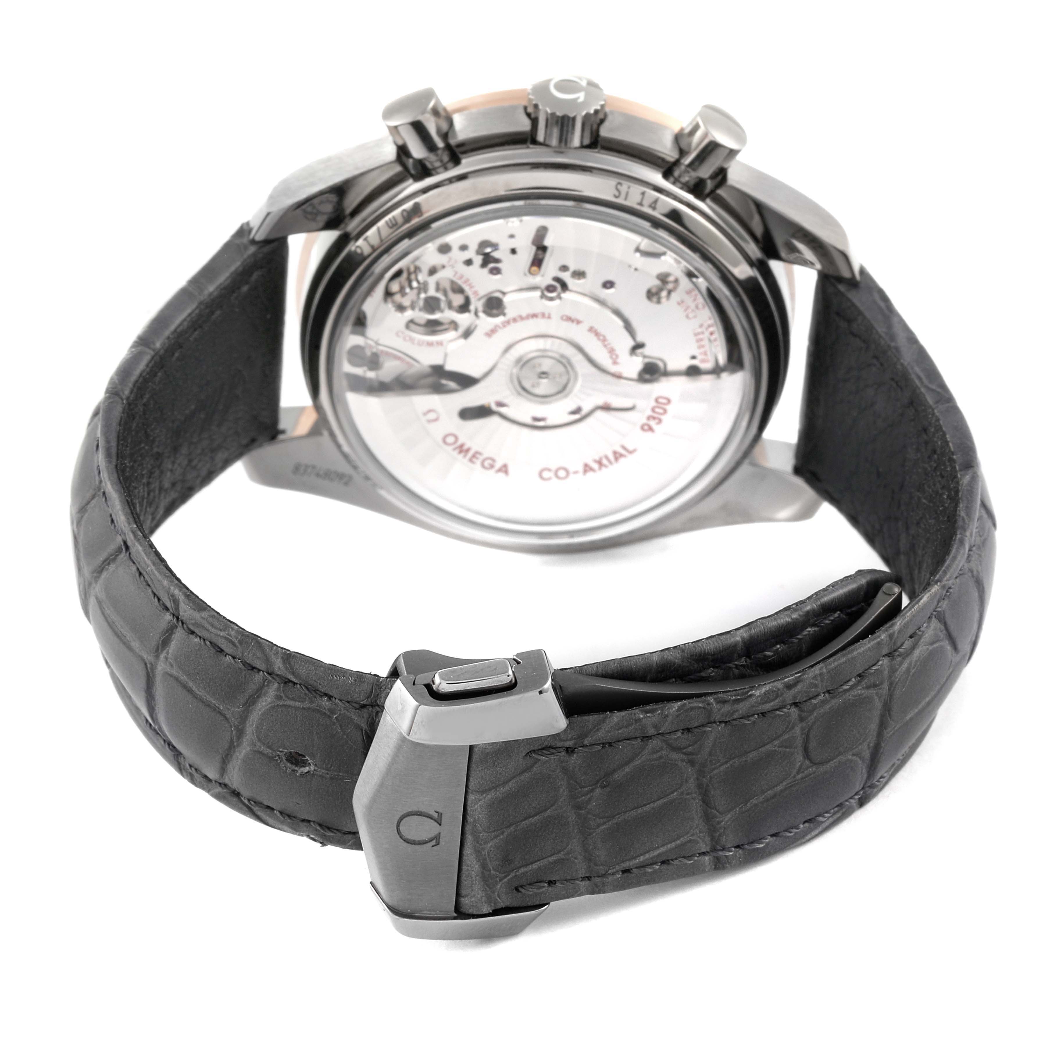 The image shows the back of an Omega Speedmaster 311.63.44.51.99.001 Men's Stainless Steel Grey Dial 311.63.44.51.99.001 Men's Stainless Steel Grey Dial watch, highlighting its movement and leather strap.