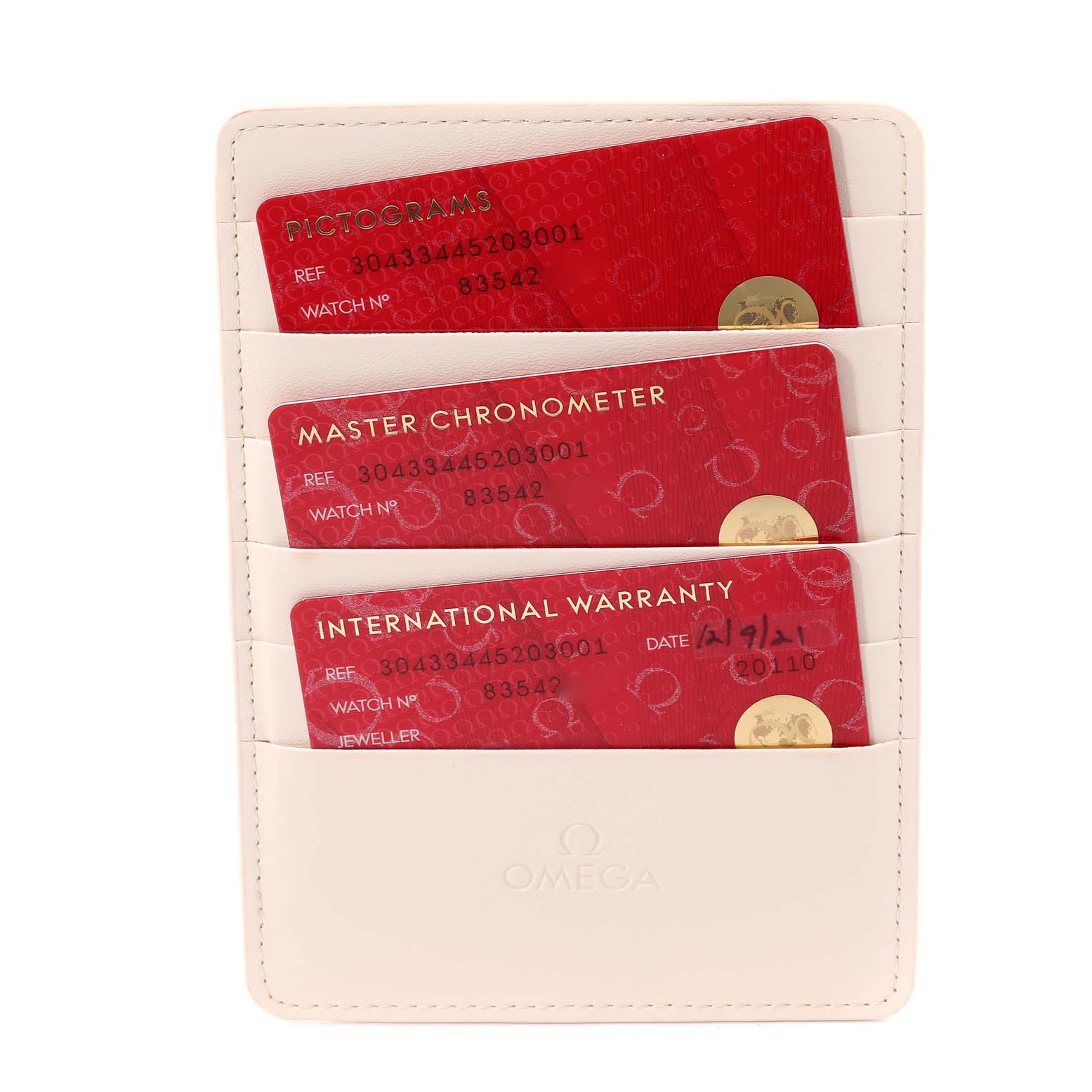 This image shows the warranty cards and certifications for an Omega Speedmaster 304.33.44.52.03.001 Men's Stainless Steel Blue Dial 304.33.44.52.03.001 Men's Stainless Steel Blue Dial watch inside a white holder.