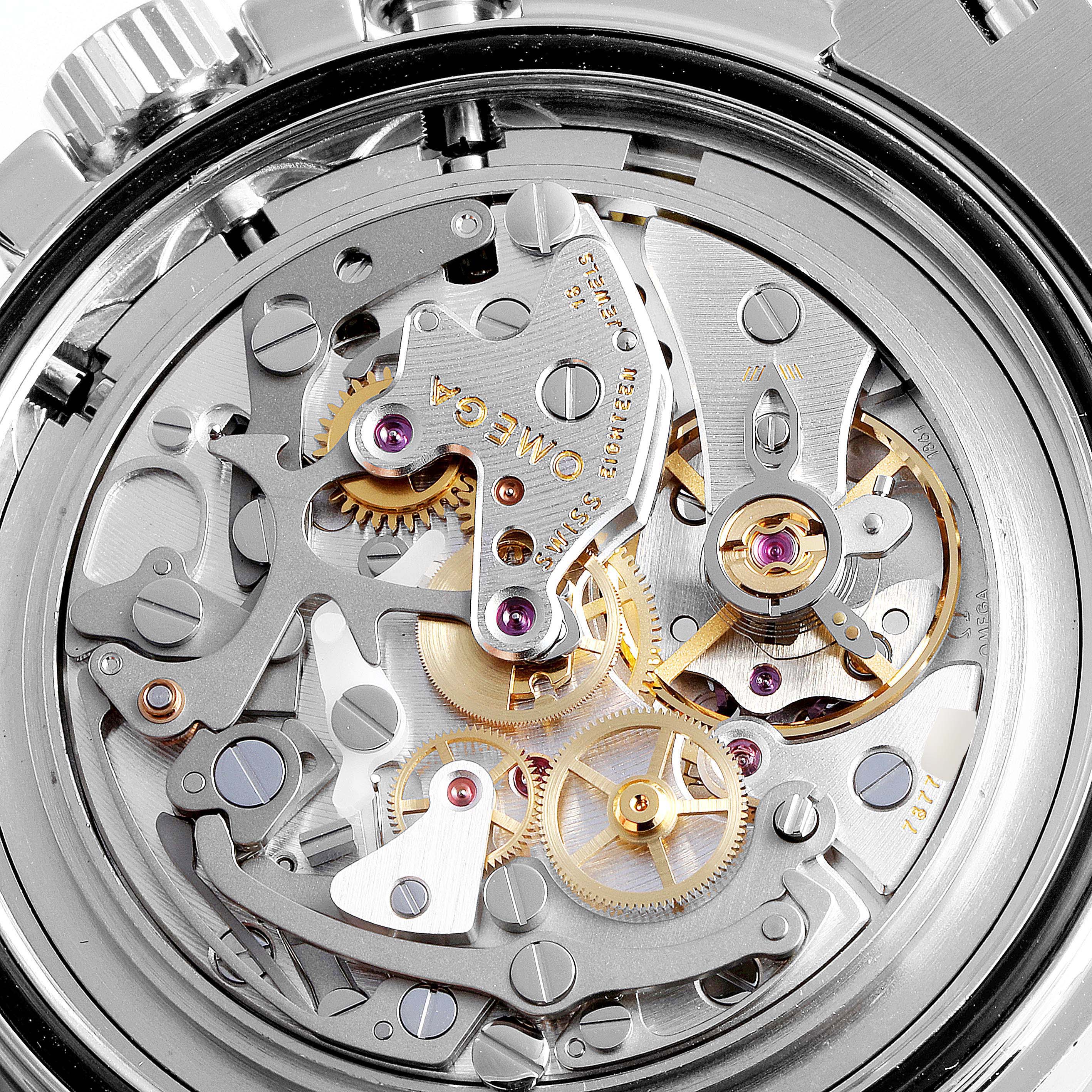 This image shows the intricate details of the movement inside an Omega Speedmaster 311.30.42.30.01.005 Men
s Stainless Steel Black Dial 311.30.42.30.01.005 Men
s Stainless Steel Black Dial watch from a close-up, top-down angle.