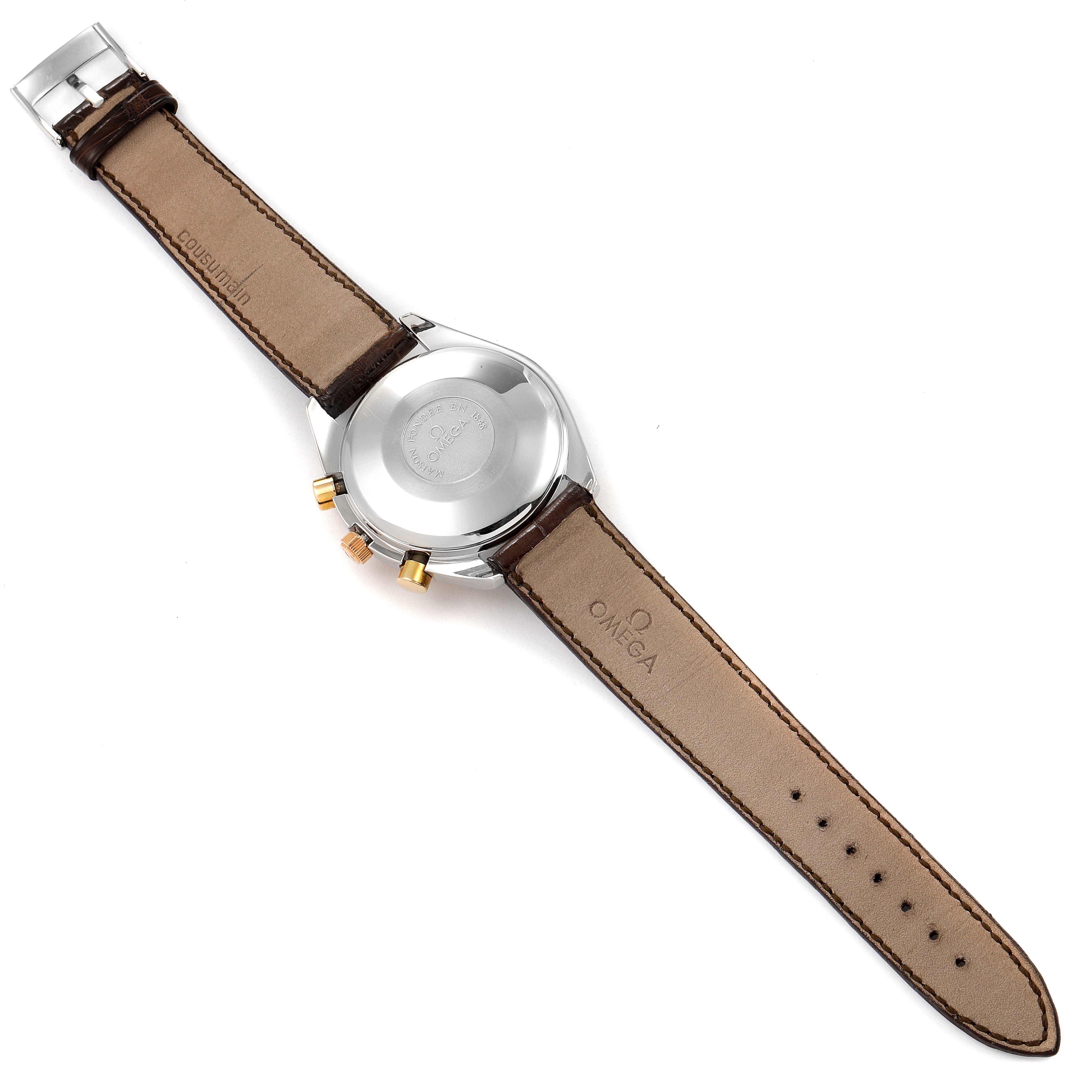 The image shows the backside of an Omega Speedmaster Men's Steel and Gold (two tone) White Dial Men's Steel and Gold (two tone) White Dial watch, highlighting the case back, leather strap, and buckle.