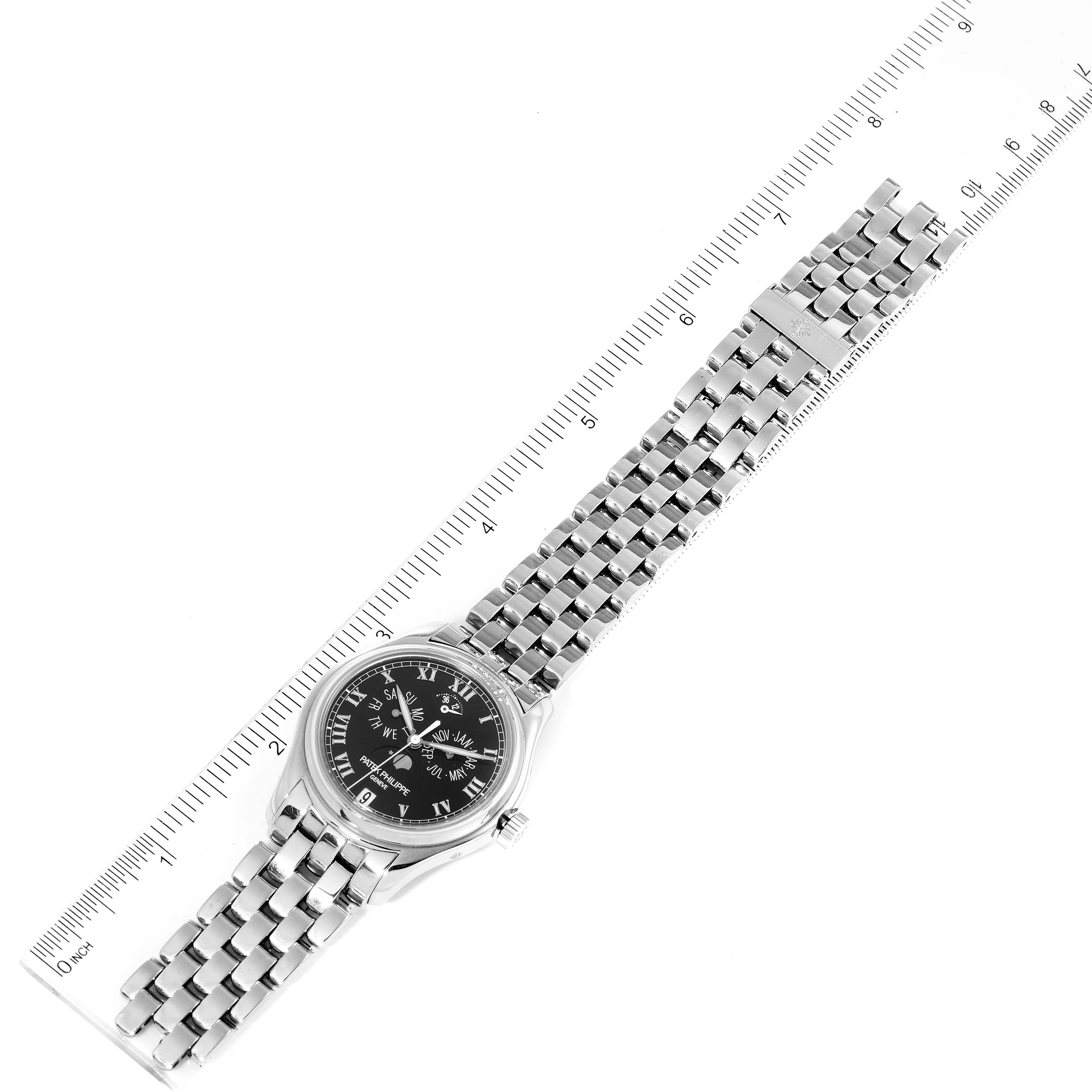 The image shows a top-down view of the Patek Philippe 5036/1G Men
s White Gold Black Dial 5036/1G Men
s White Gold Black Dial Annual Calendar Moonphase White Gold Mens Watch 5036 with a ruler for scale.