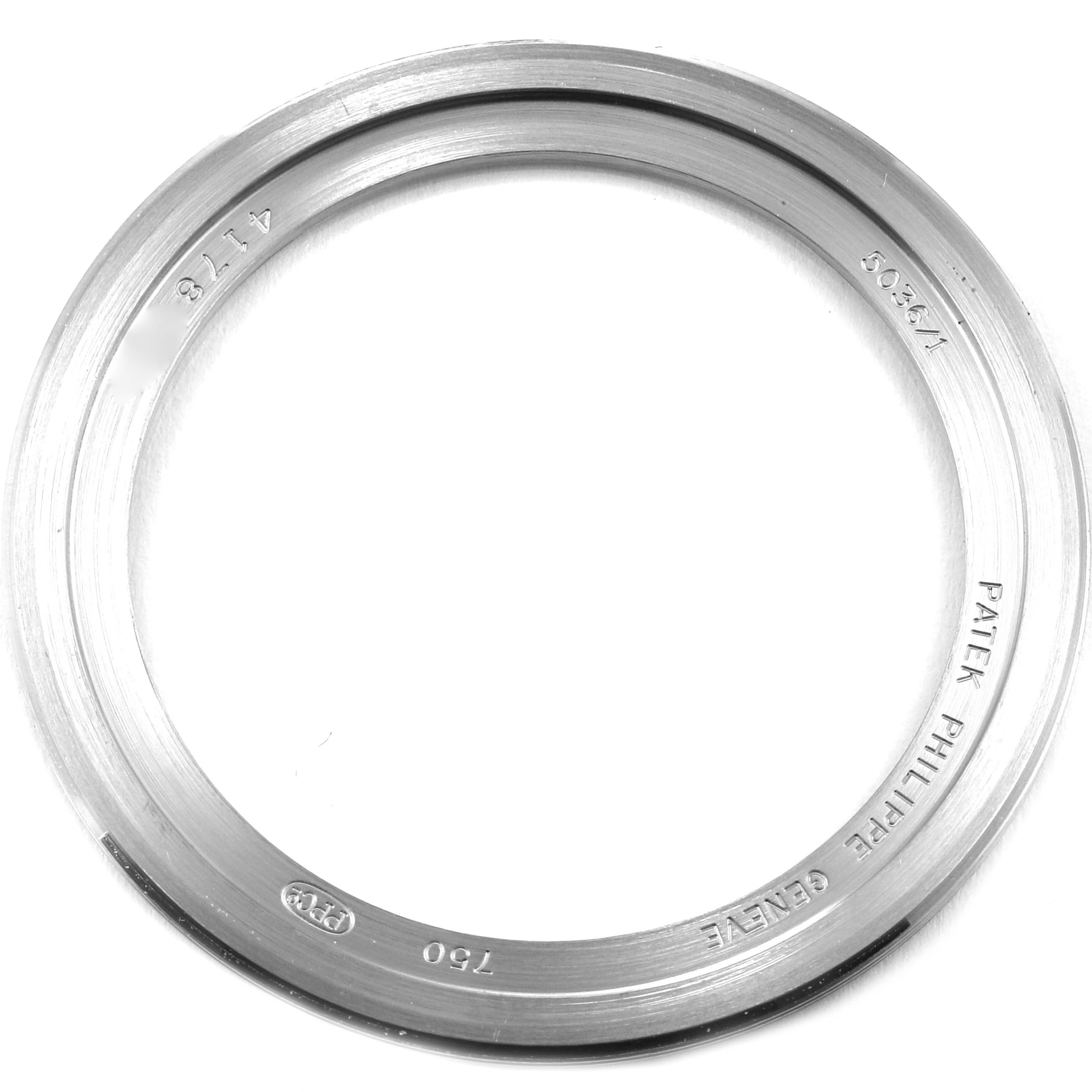 This image shows the bezel of the Patek Philippe 5036/1G Men
s White Gold Black Dial 5036/1G Men
s White Gold Black Dial Annual Calendar Moonphase White Gold Mens Watch 5036, viewed from above.