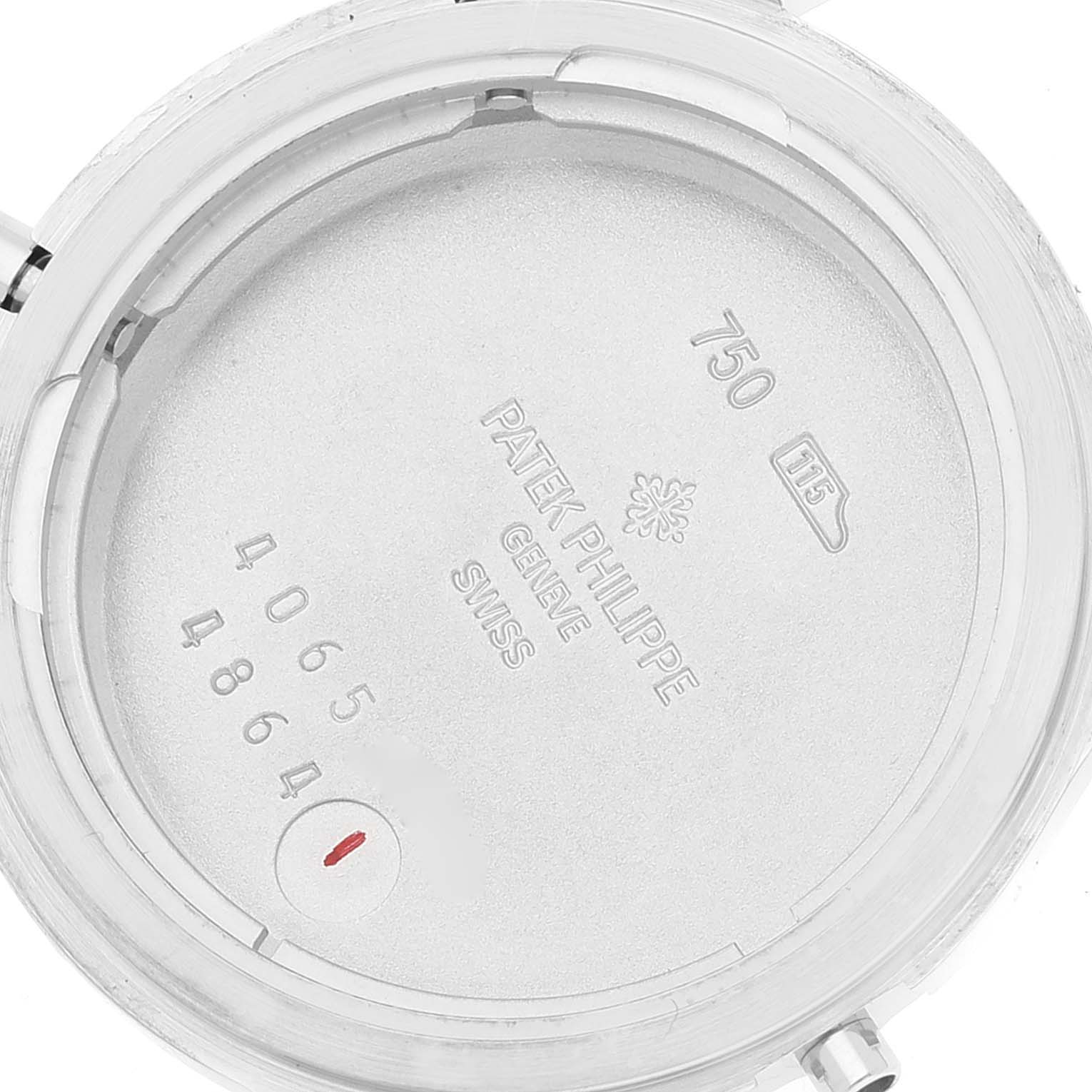 This is a close-up view of the inner case back of a Patek Philippe Calatrava 4864G Women's White Gold White Dial 4864G Women's White Gold White Dial watch, displaying model information and serial numbers.