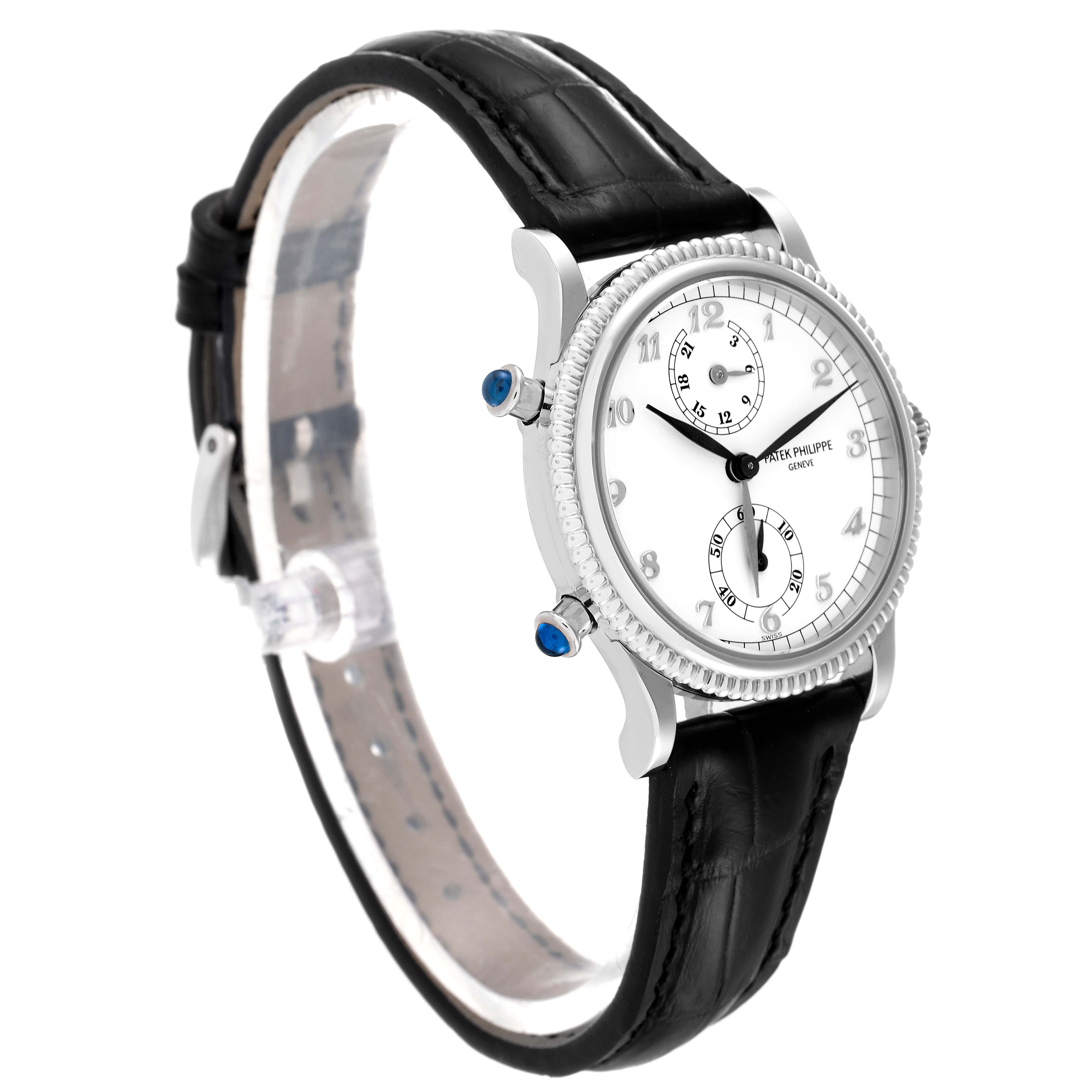 The Patek Philippe Calatrava 4864G Women's White Gold White Dial 4864G Women's White Gold White Dial watch is shown at a slight side angle, displaying its dial, black leather strap, and detailed bezel.
