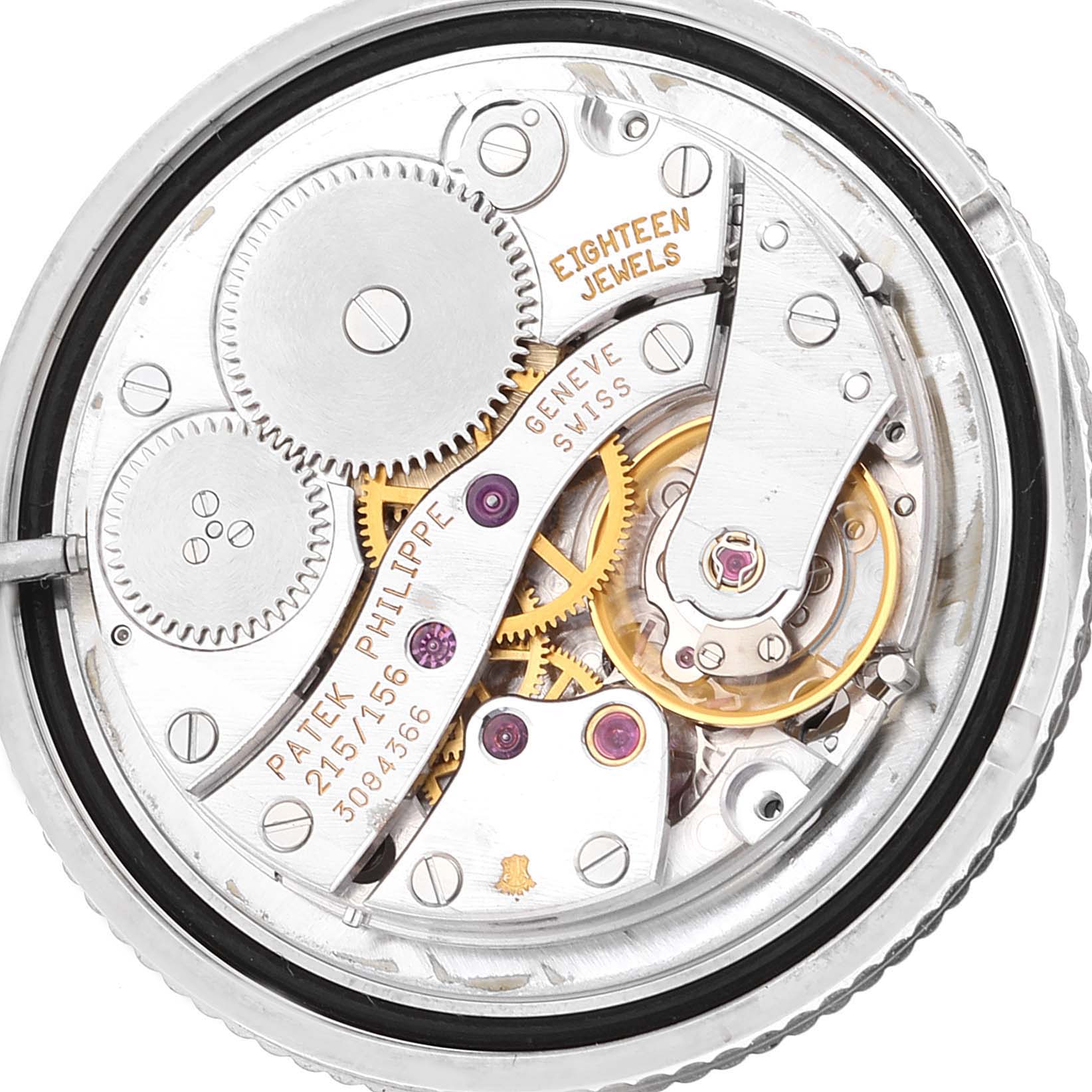 The image shows a close-up view of the movement of a Patek Philippe Calatrava 4864G Women's White Gold White Dial 4864G Women's White Gold White Dial watch, highlighting gears and jewels.