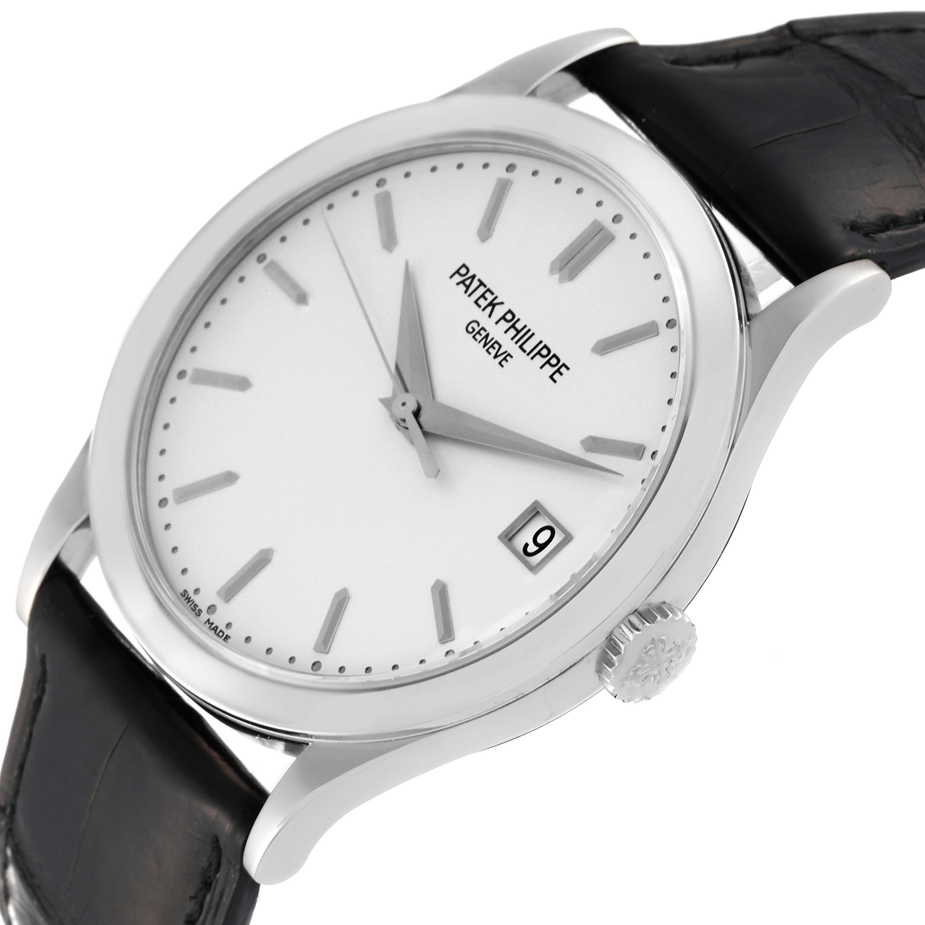 The image shows a tilted view of the Patek Philippe Calatrava 5296G-010 Men's White Gold Silver Dial 5296G-010 Men's White Gold Silver Dial watch, highlighting its dial, markers, crown, and leather strap.