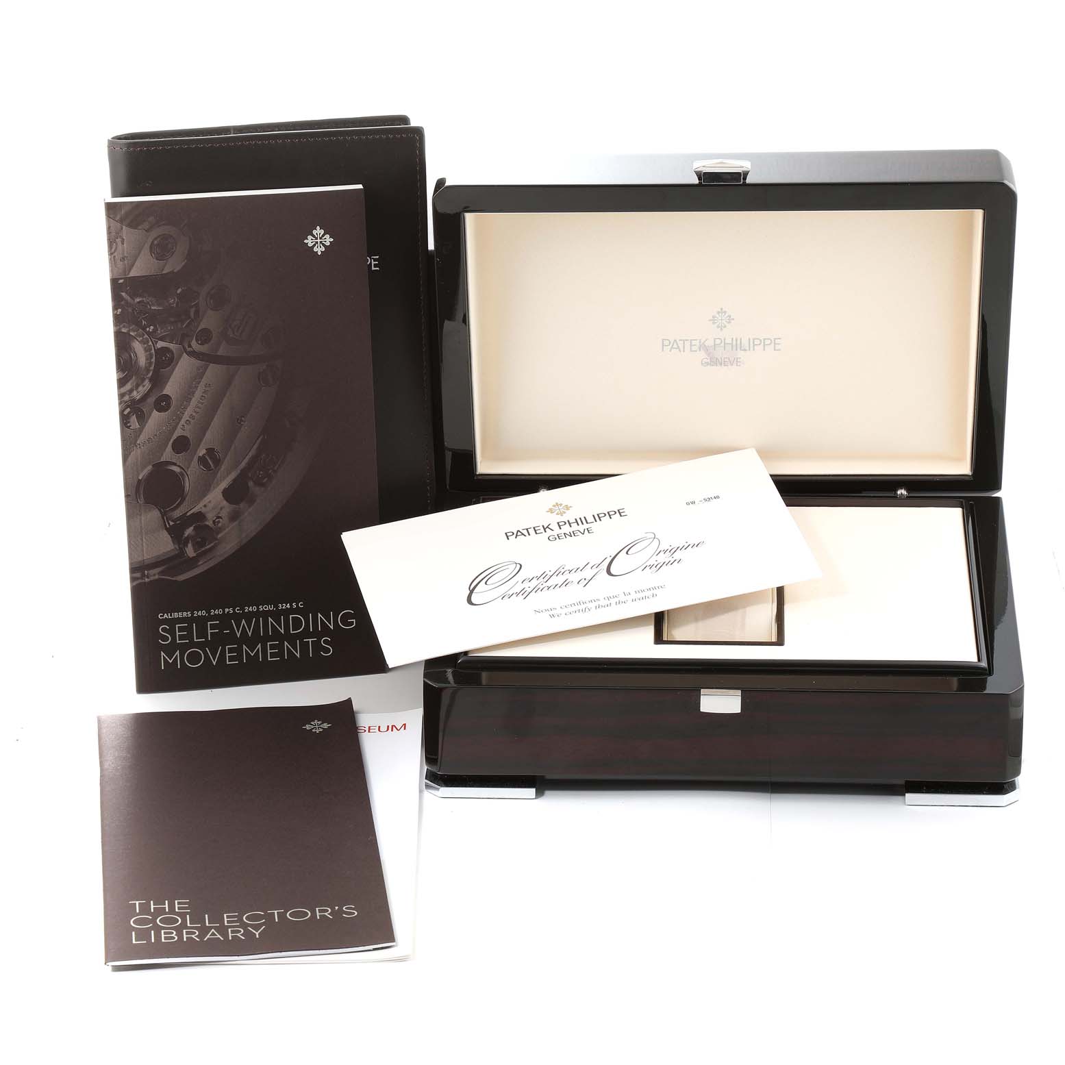 The image shows the packaging and documentation for a Patek Philippe Calatrava 5296G-010 Men's White Gold Silver Dial 5296G-010 Men's White Gold Silver Dial watch, including the box, certificate, and booklets.