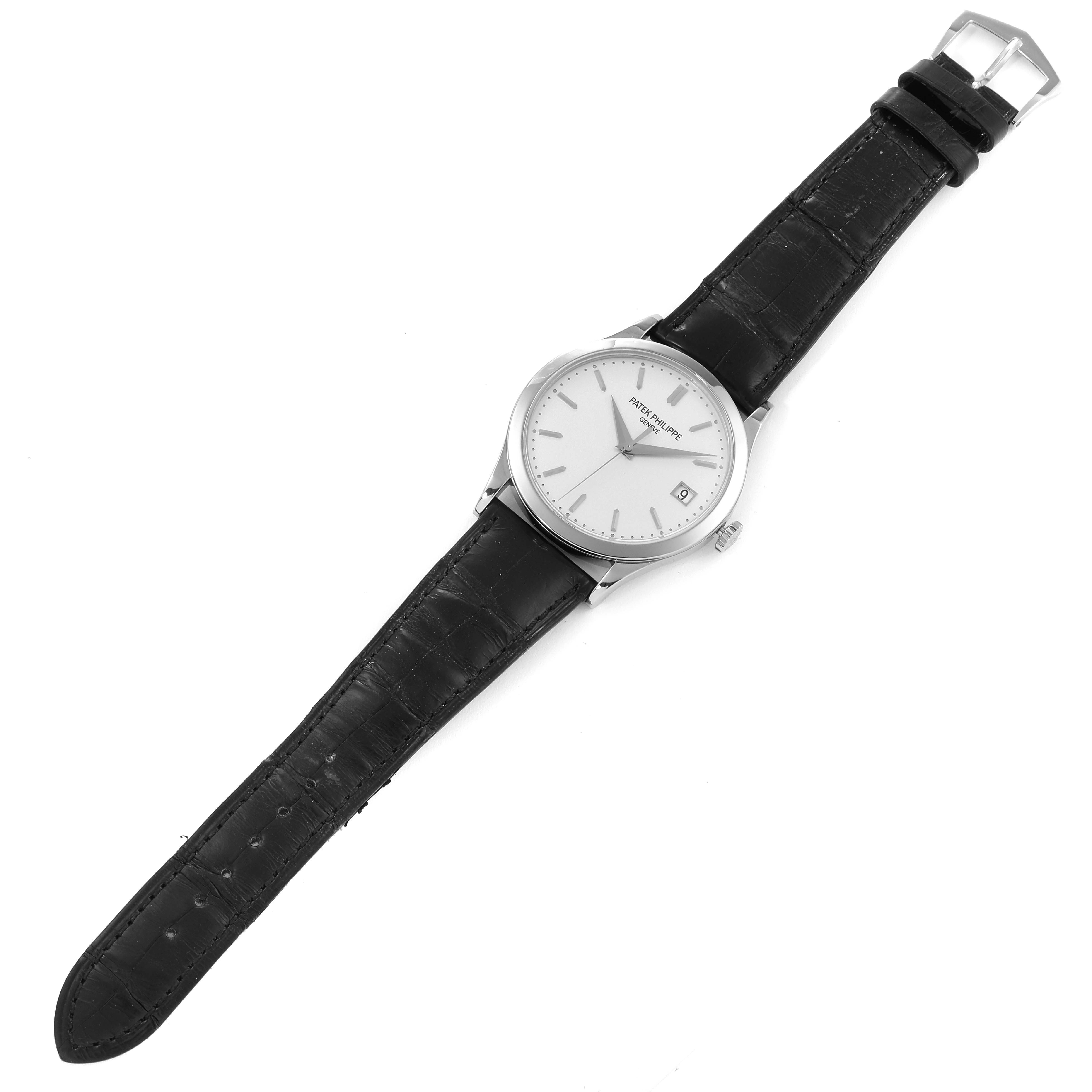 This image shows a top view of a Patek Philippe Calatrava 5296G-010 Men's White Gold Silver Dial 5296G-010 Men's White Gold Silver Dial watch with its black leather strap fully extended.