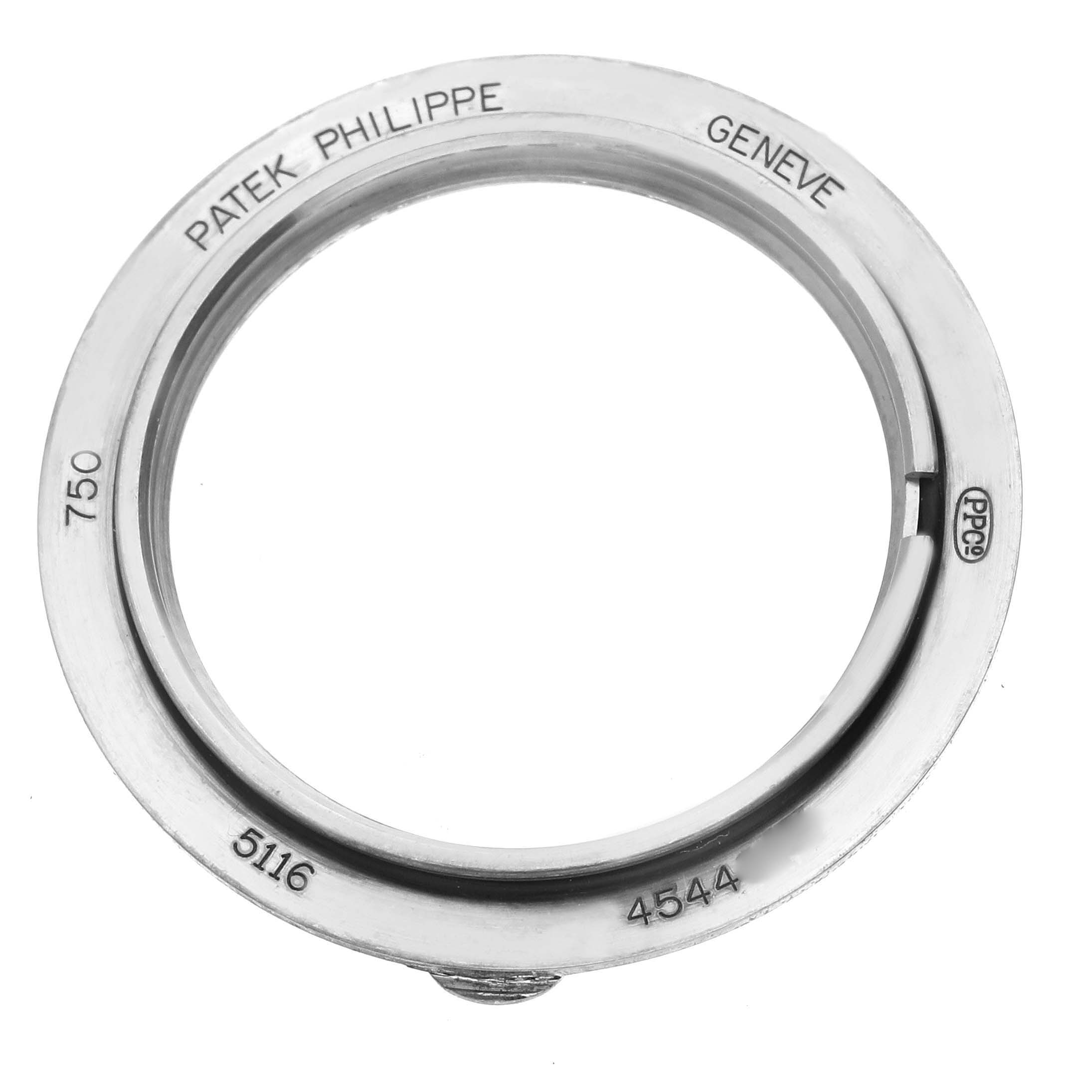 The image shows a top-down view of the bezel for the Calatrava model by Patek Philippe.