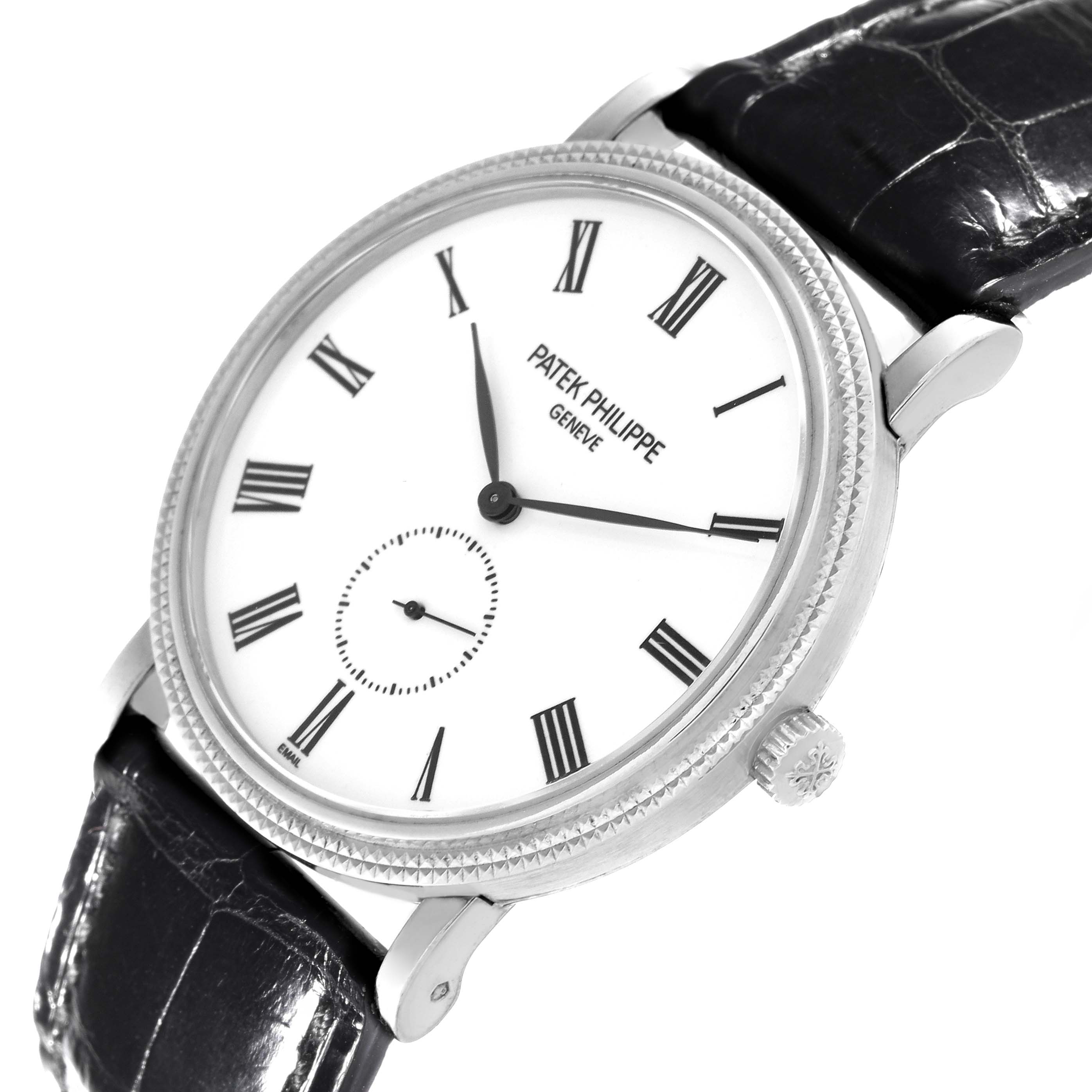 The image shows a Patek Philippe Calatrava 5116G Men
s White Gold White Dial 5116G Men
s White Gold White Dial watch at an angle featuring the watch face, bezel, crown, and part of the leather strap.