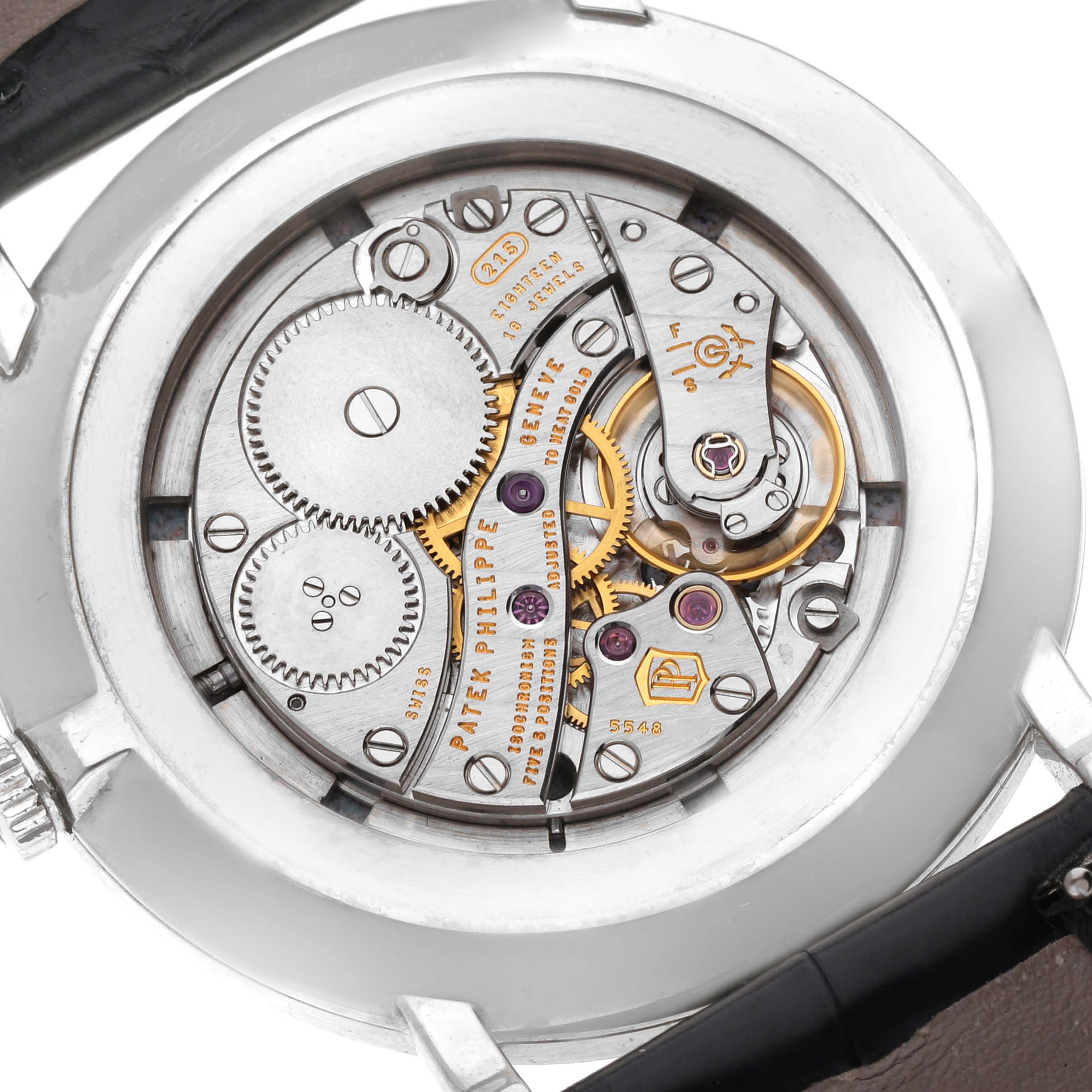 The image shows the back of a Patek Philippe Calatrava 5116G Men
s White Gold White Dial 5116G Men
s White Gold White Dial watch, revealing its intricate mechanical movement.