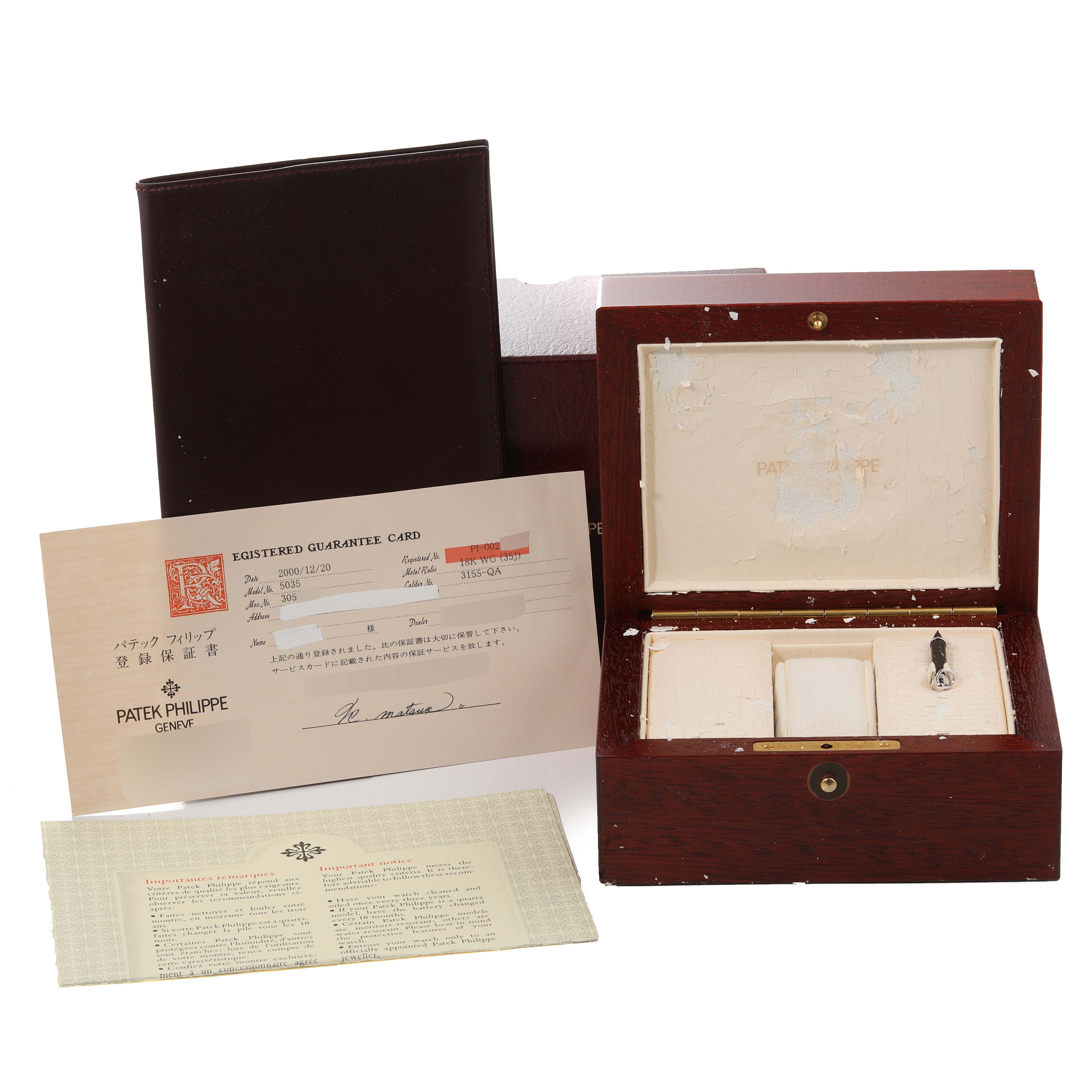 The image shows the accessories of a Patek Philippe Complications 5035G Men's White Gold Black Dial 5035G Men's White Gold Black Dial model, including the box, warranty card, and documents.