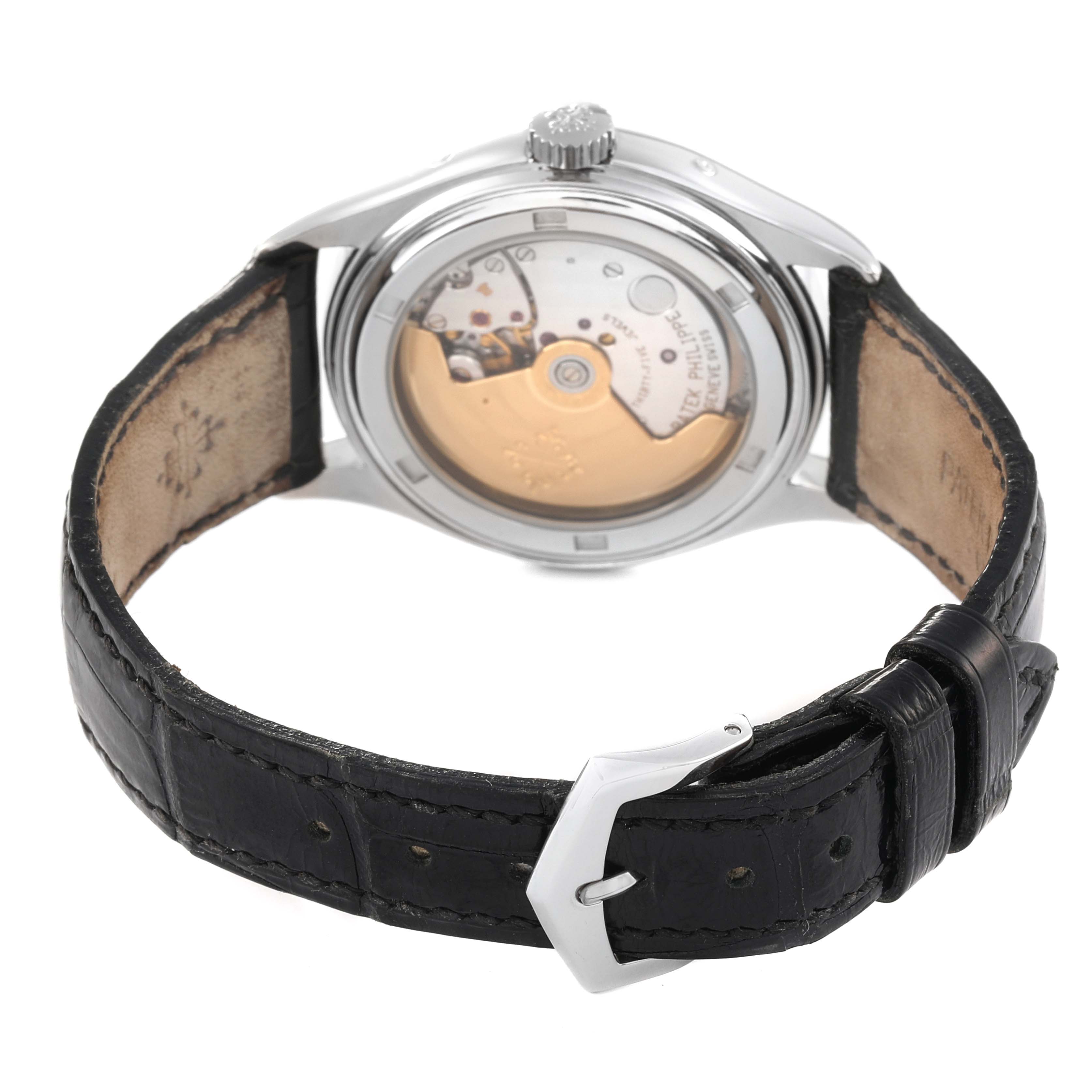 The image shows the back of the Patek Philippe Complications 5035G Men's White Gold Black Dial 5035G Men's White Gold Black Dial watch, showcasing the movement and leather strap with buckle.