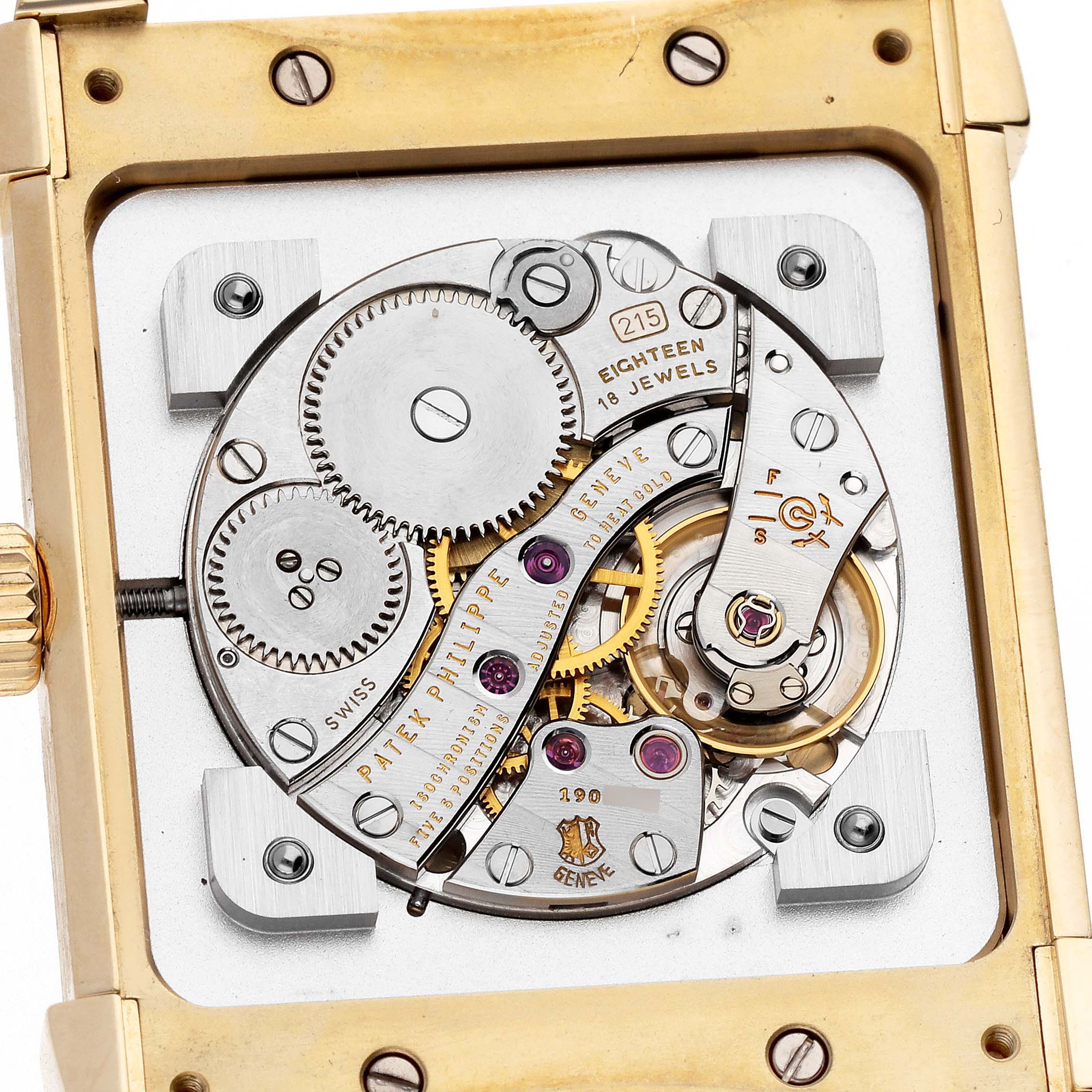 The image shows a close-up of the movement and inner workings of the Patek Philippe Gondolo 5111J Men's Yellow Gold Silver Dial 5111J Men's Yellow Gold Silver Dial watch, highlighting gears and jewels.