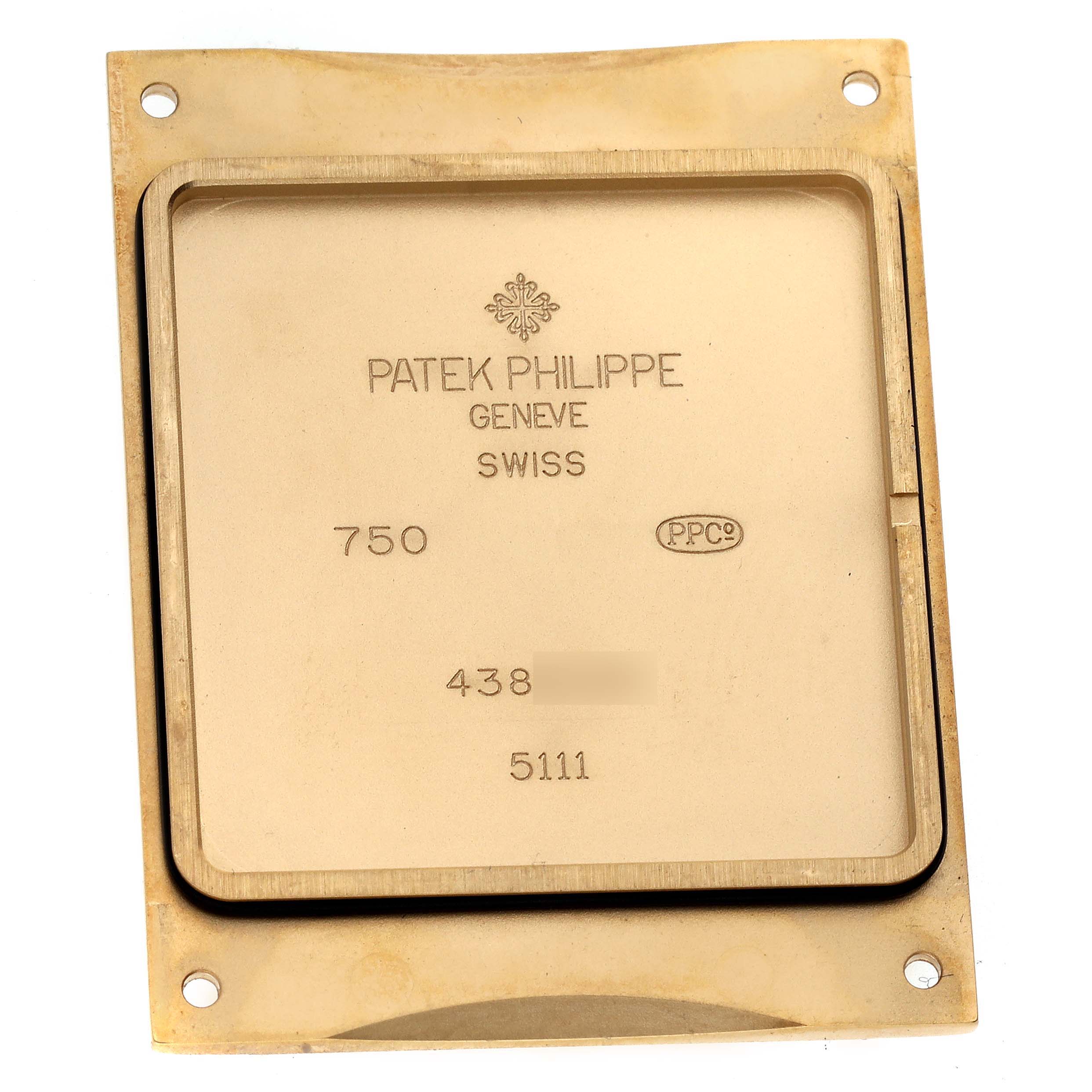 The image shows the case back of a Patek Philippe Gondolo 5111J Men's Yellow Gold Silver Dial 5111J Men's Yellow Gold Silver Dial watch, viewed from a top-down angle.