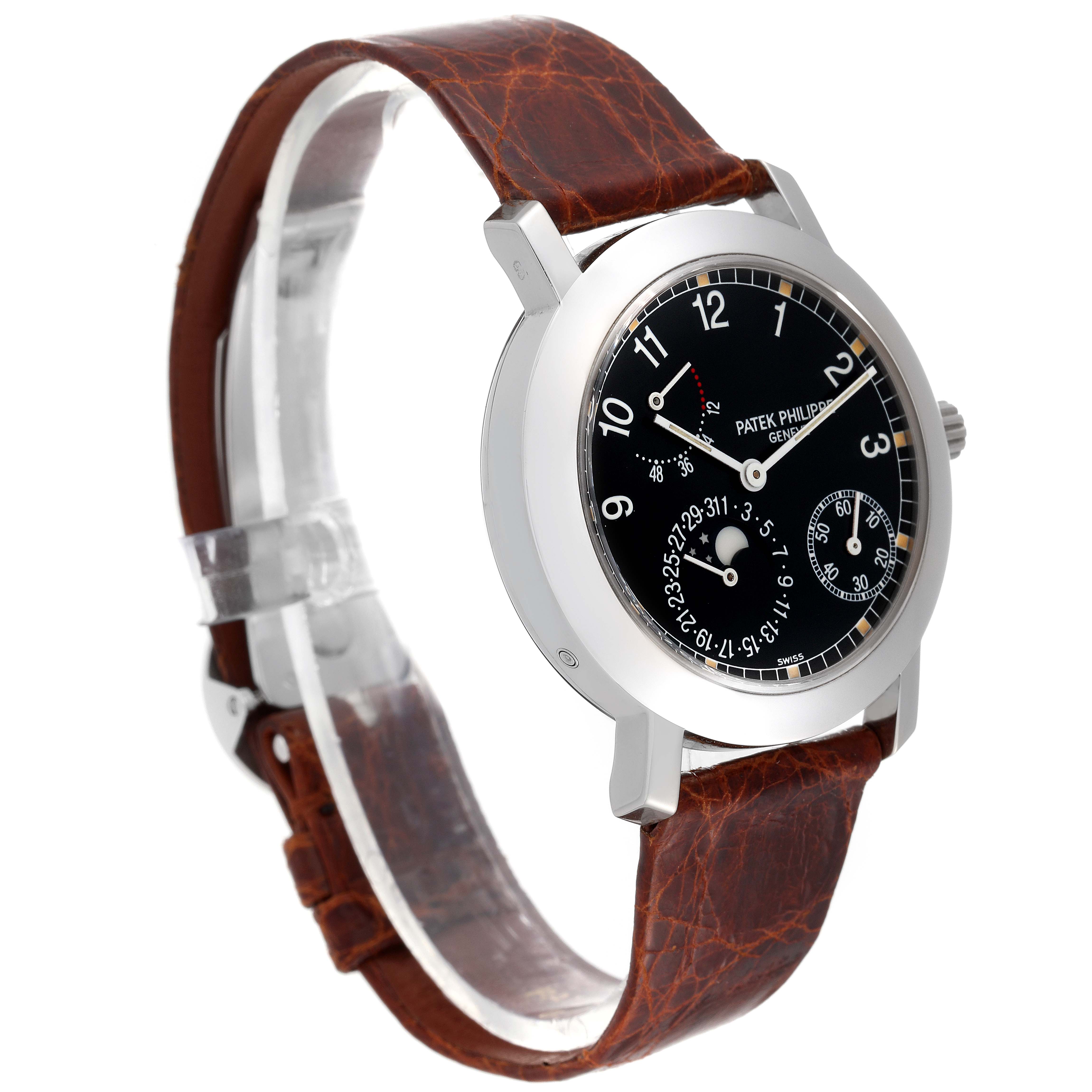 The image shows a side angle of the Patek Philippe Complications 5055G-001 Men
s White Gold Black Dial 5055G-001 Men
s White Gold Black Dial watch, highlighting the case, dial, and brown leather strap.