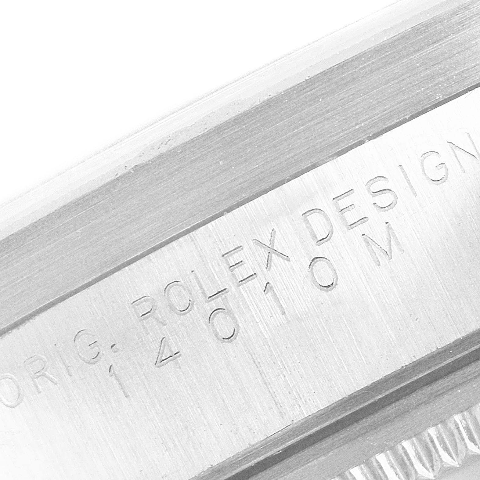 This close-up image shows the engraved case side of a Rolex Air-King 14010 Men's Stainless Steel Blue Dial 14010 Men's Stainless Steel Blue Dial watch.