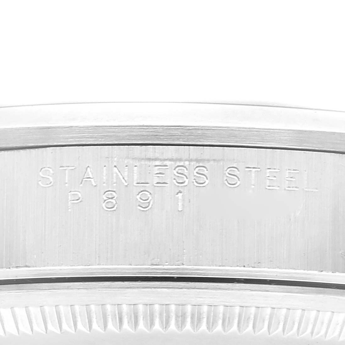 This image shows a close-up view of the outer rim of a Rolex Air-King 14000 Men's Stainless Steel Blue Dial 14000 Men's Stainless Steel Blue Dial watch, featuring stainless steel engraving.