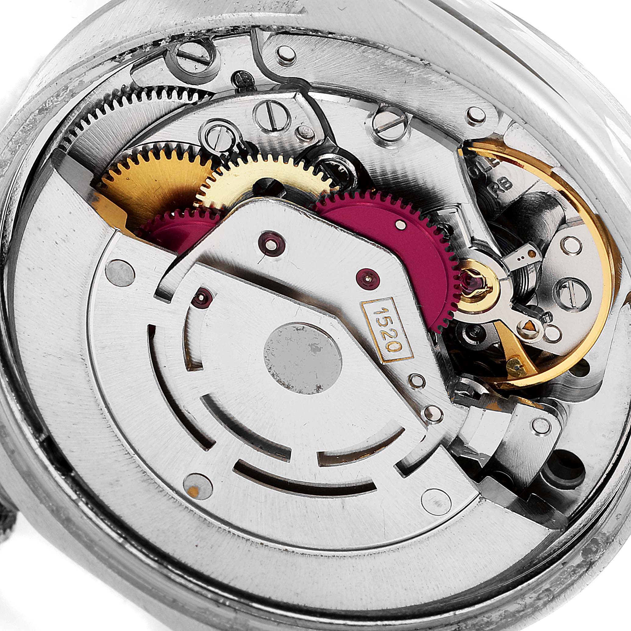 The image shows the internal mechanical movement of the Vintage Collection Rolex watch at a close-up angle.