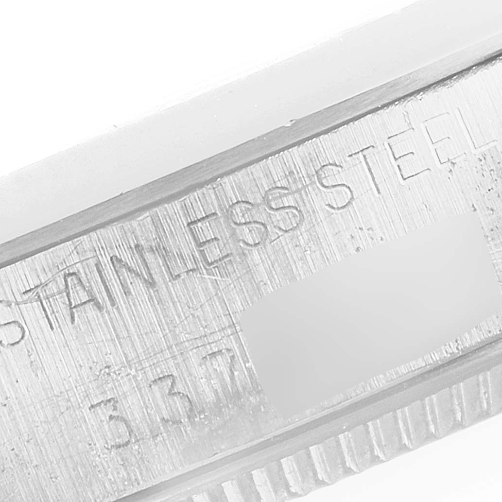 The image shows a close-up of the stainless steel band or casing of a Vintage Collection model by Rolex.