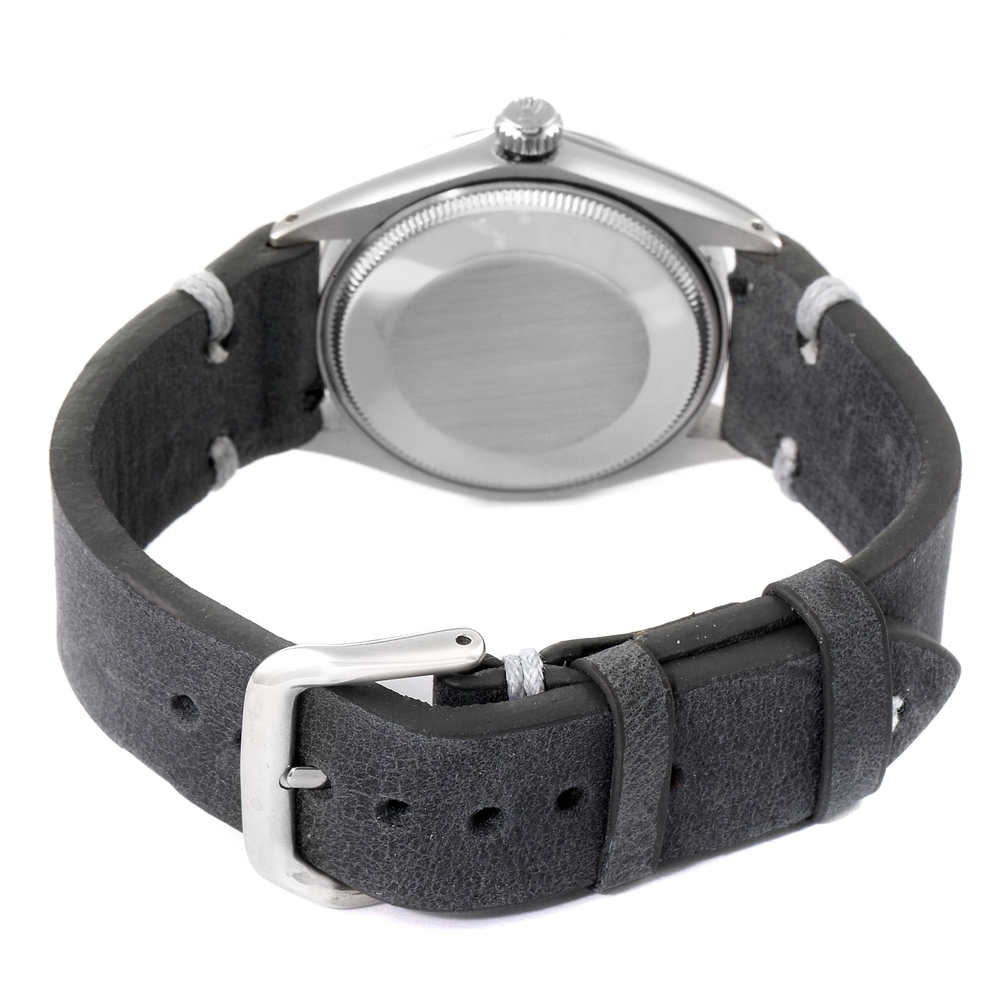 The image shows the back view of a Rolex Vintage Collection 5500 Men's Stainless Steel Silver Dial 5500 Men's Stainless Steel Silver Dial watch, highlighting its closed case back and leather strap.