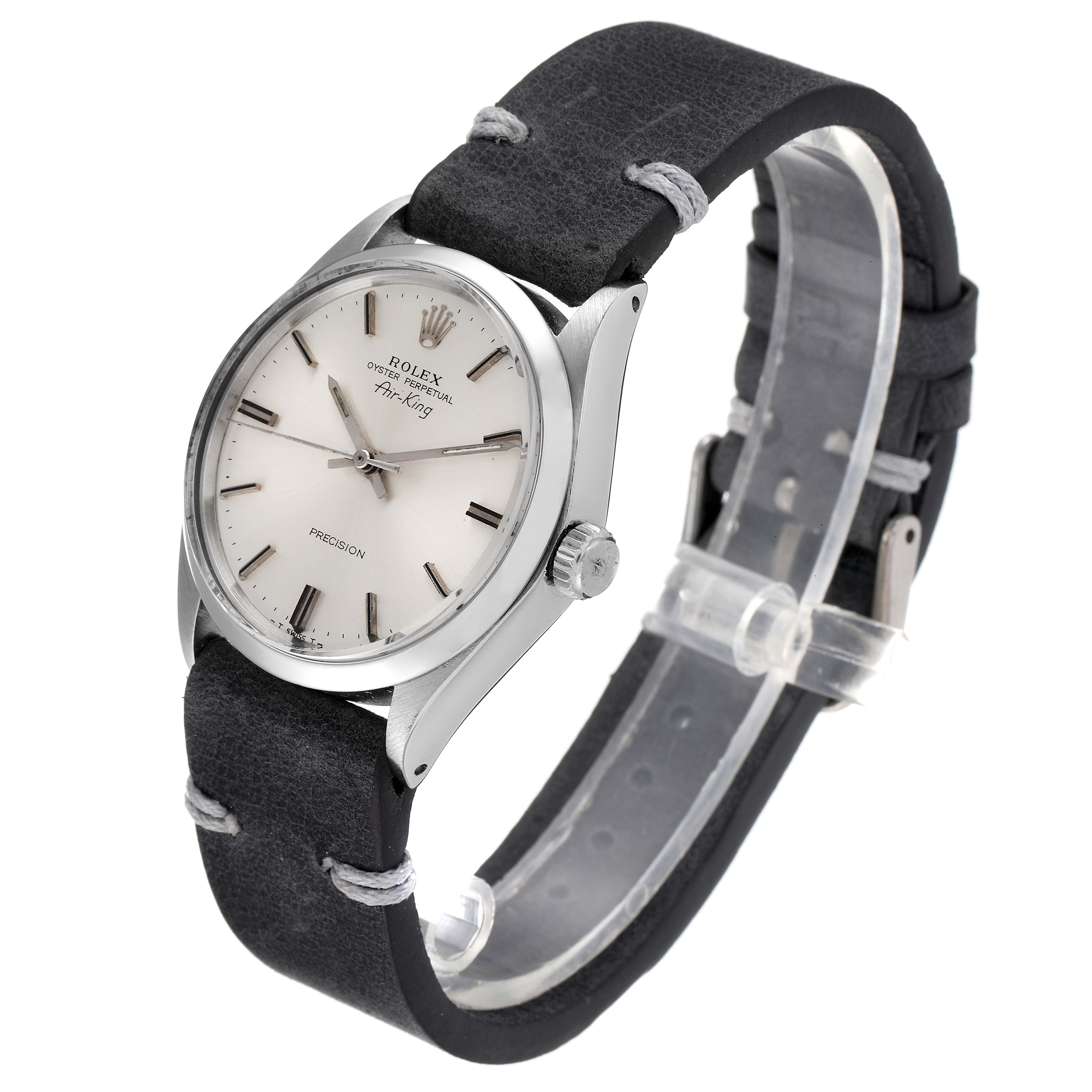 The Vintage Collection model by Rolex is shown at a three-quarter angle, displaying the watch face, bezel, and leather strap.
