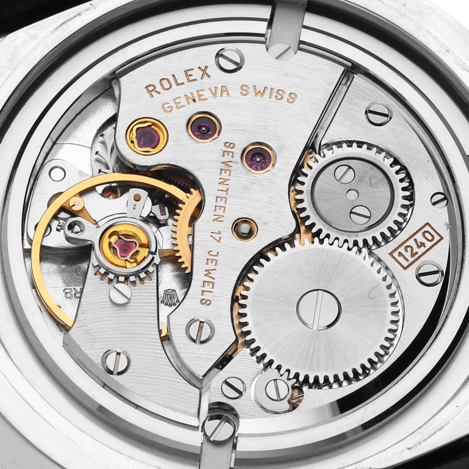 This image shows the intricate inner movement of the Rolex Cellini 5240 Men's White Gold Mother of Pearl Dial 5240 Men's White Gold Mother of Pearl Dial watch, highlighting gears, jewels, and engravings.