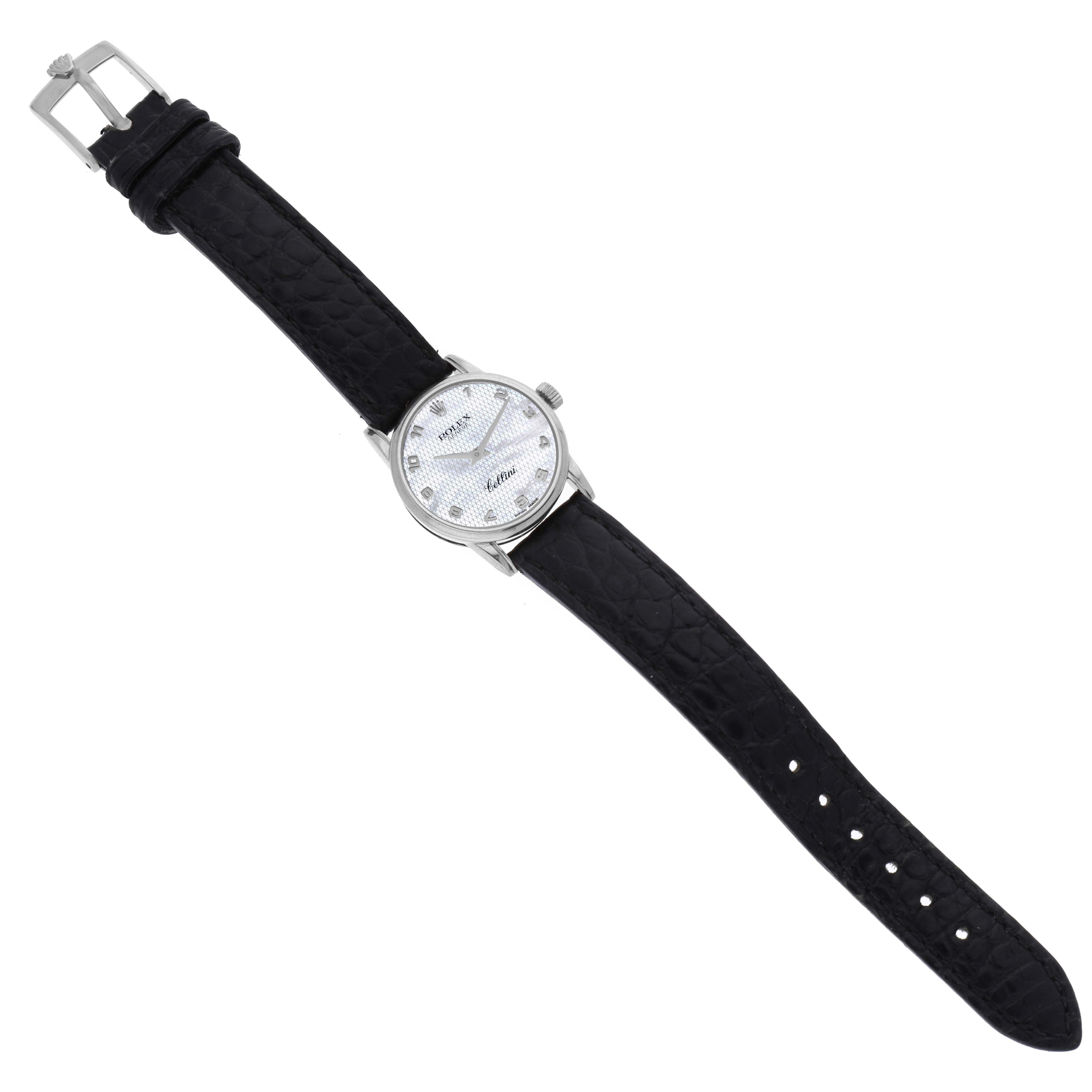 The image shows a full view of a Rolex Cellini 6111 Women's White Gold Mother of Pearl Dial 6111 Women's White Gold Mother of Pearl Dial watch with a black leather strap and silver dial positioned diagonally.