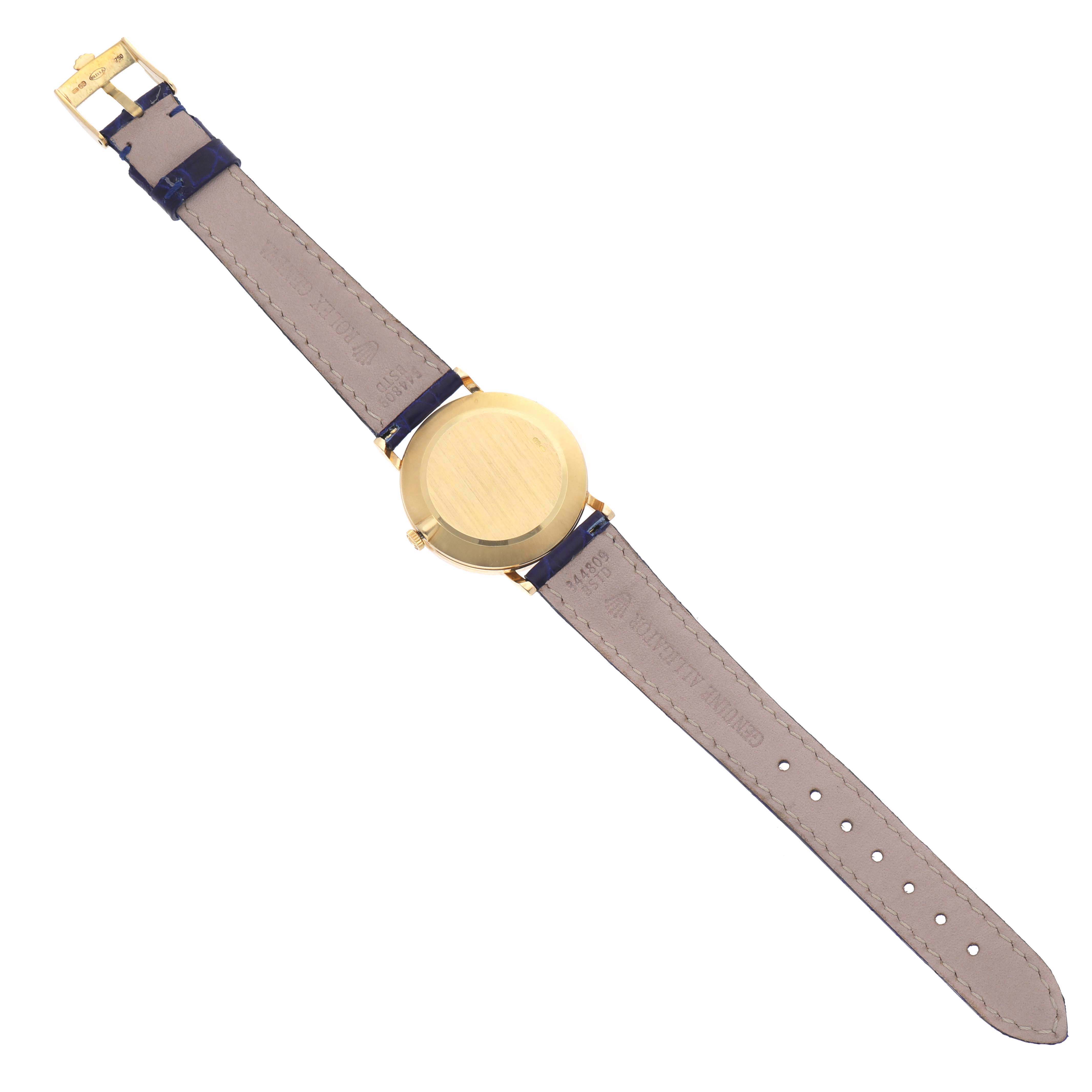 This image shows the back view of a Rolex Cellini 5112 Men's Yellow Gold Mother of Pearl Dial 5112 Men's Yellow Gold Mother of Pearl Dial watch, displaying its gold case and brown leather strap.