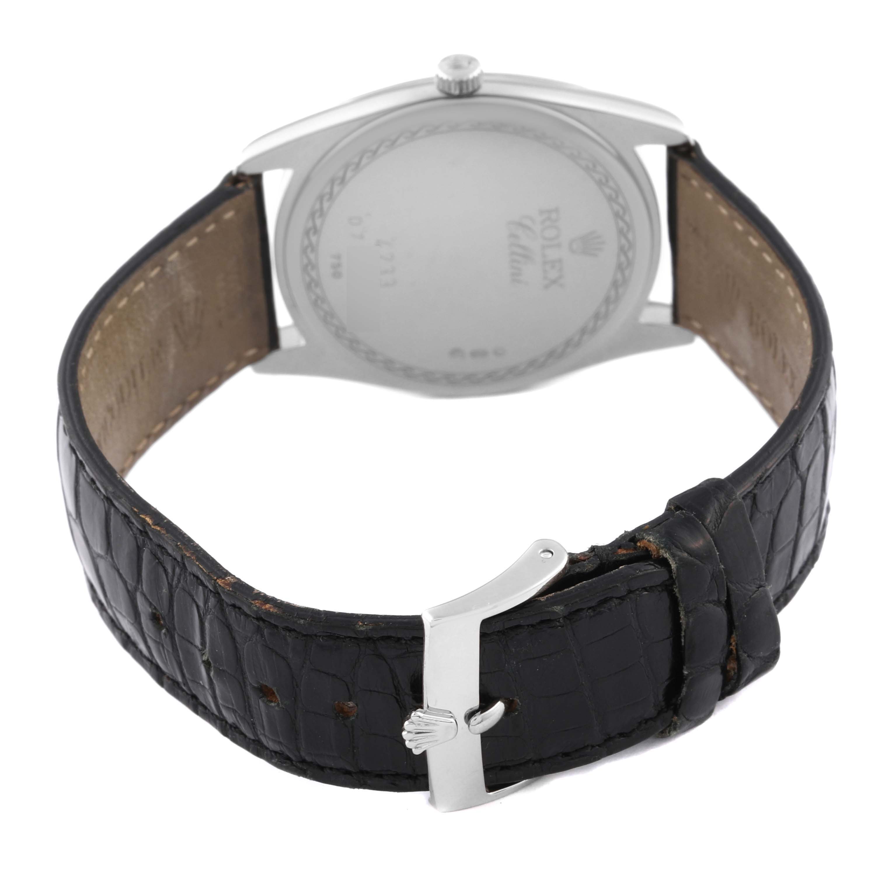 The image shows the back side of a Rolex Cellini 4233/9 Men's White Gold White Dial 4233/9 Men's White Gold White Dial watch, highlighting the case back, crown, and leather strap with the buckle.