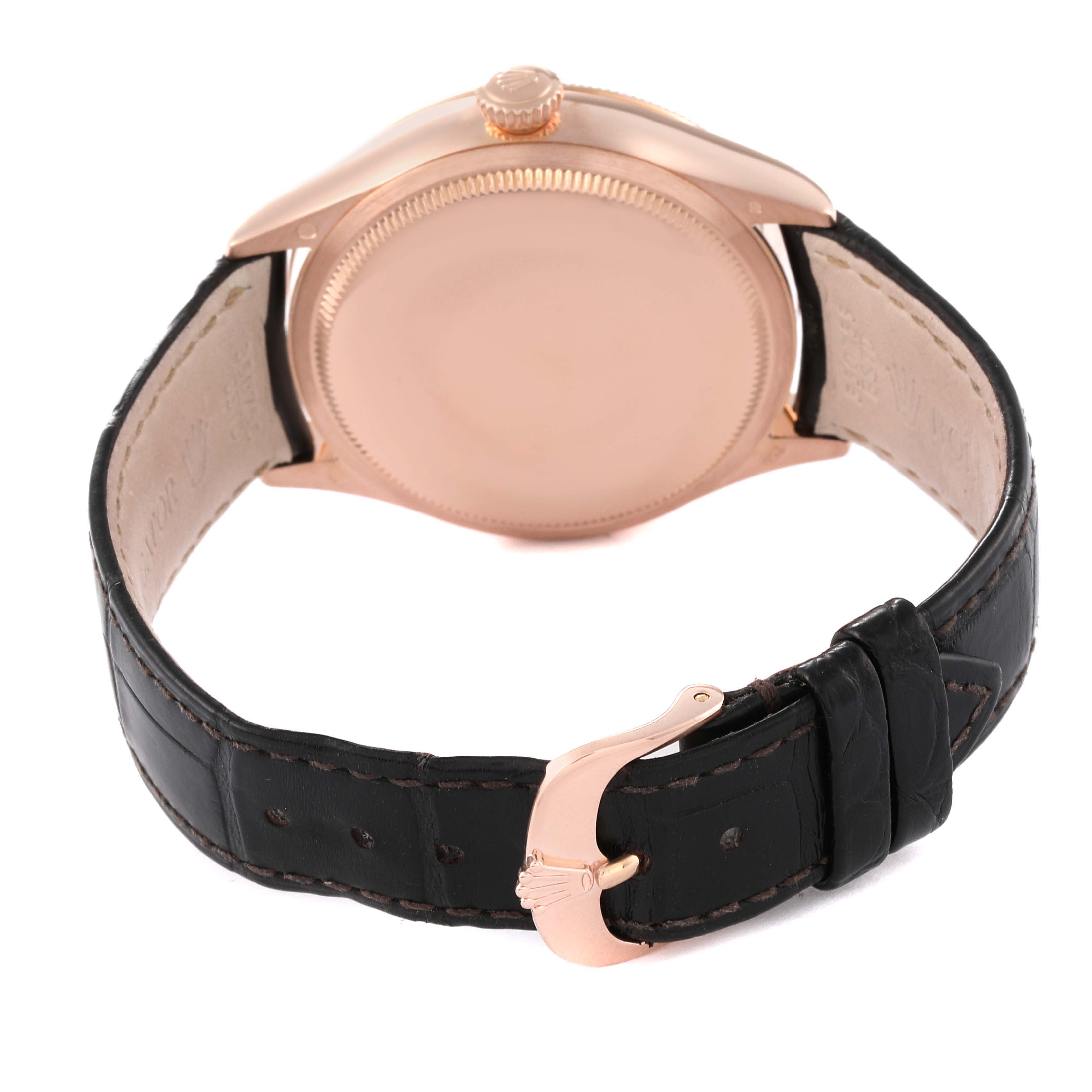 The image shows the back view of a Rolex Cellini 50515 Men's Rose Gold Silver Dial 50515 Men's Rose Gold Silver Dial watch, highlighting its case, crown, and leather strap with a buckle.
