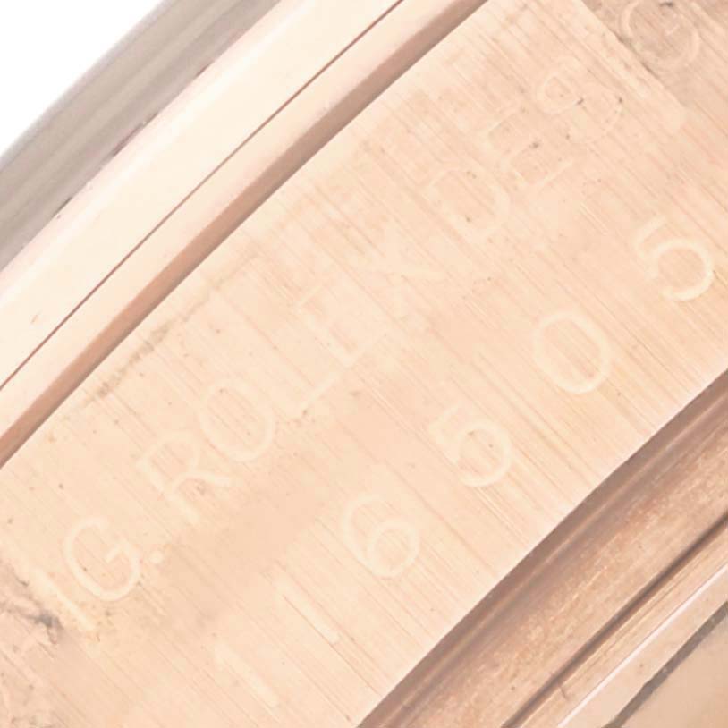 This close-up image shows the engraved inner bezel of a Rolex Daytona 116505 Men
s Rose Gold Pink Dial 116505 Men
s Rose Gold Pink Dial watch.