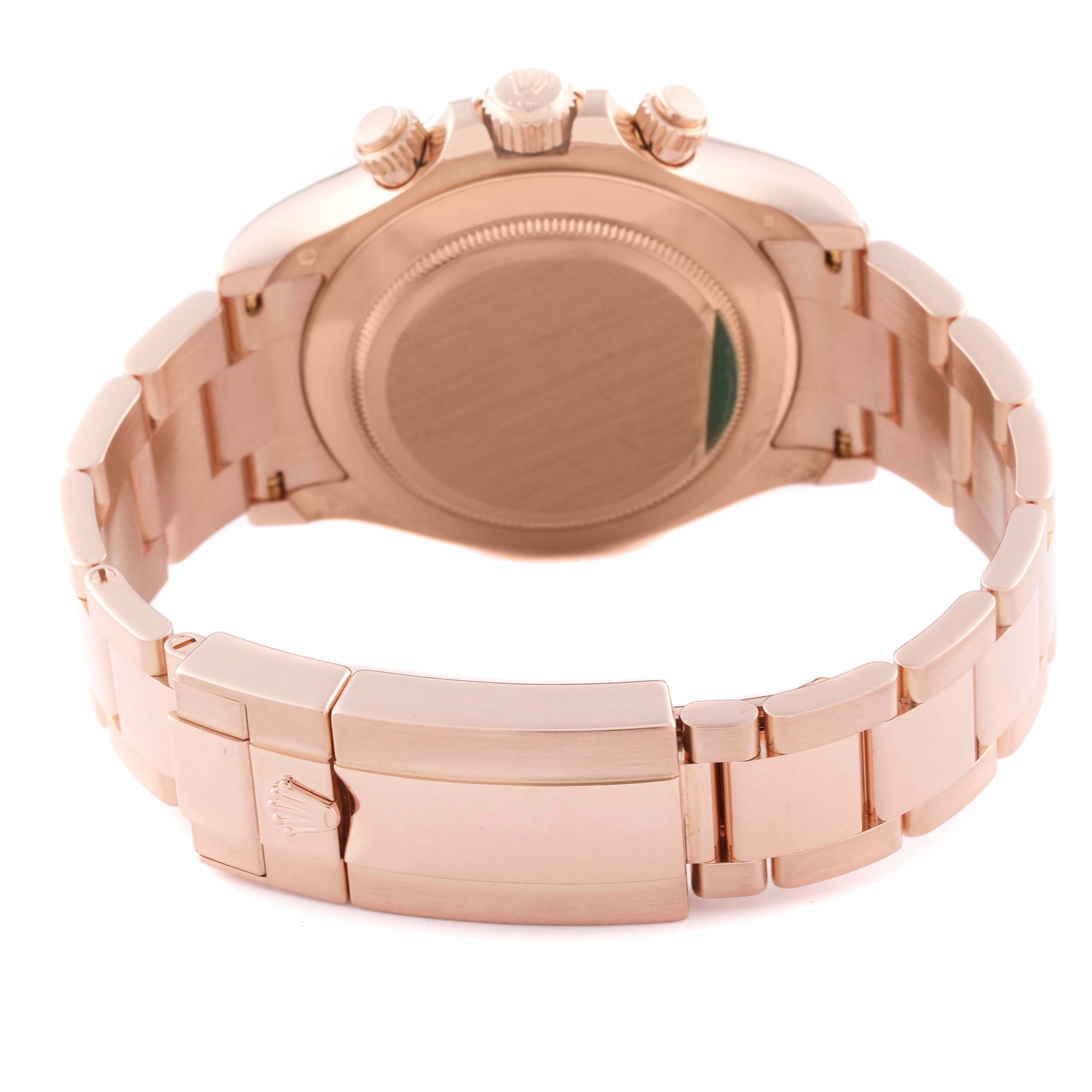 The image shows the back and clasp of the Rolex Daytona 116505 Men
s Rose Gold Pink Dial 116505 Men
s Rose Gold Pink Dial watch, highlighting its metallic strap and case back.