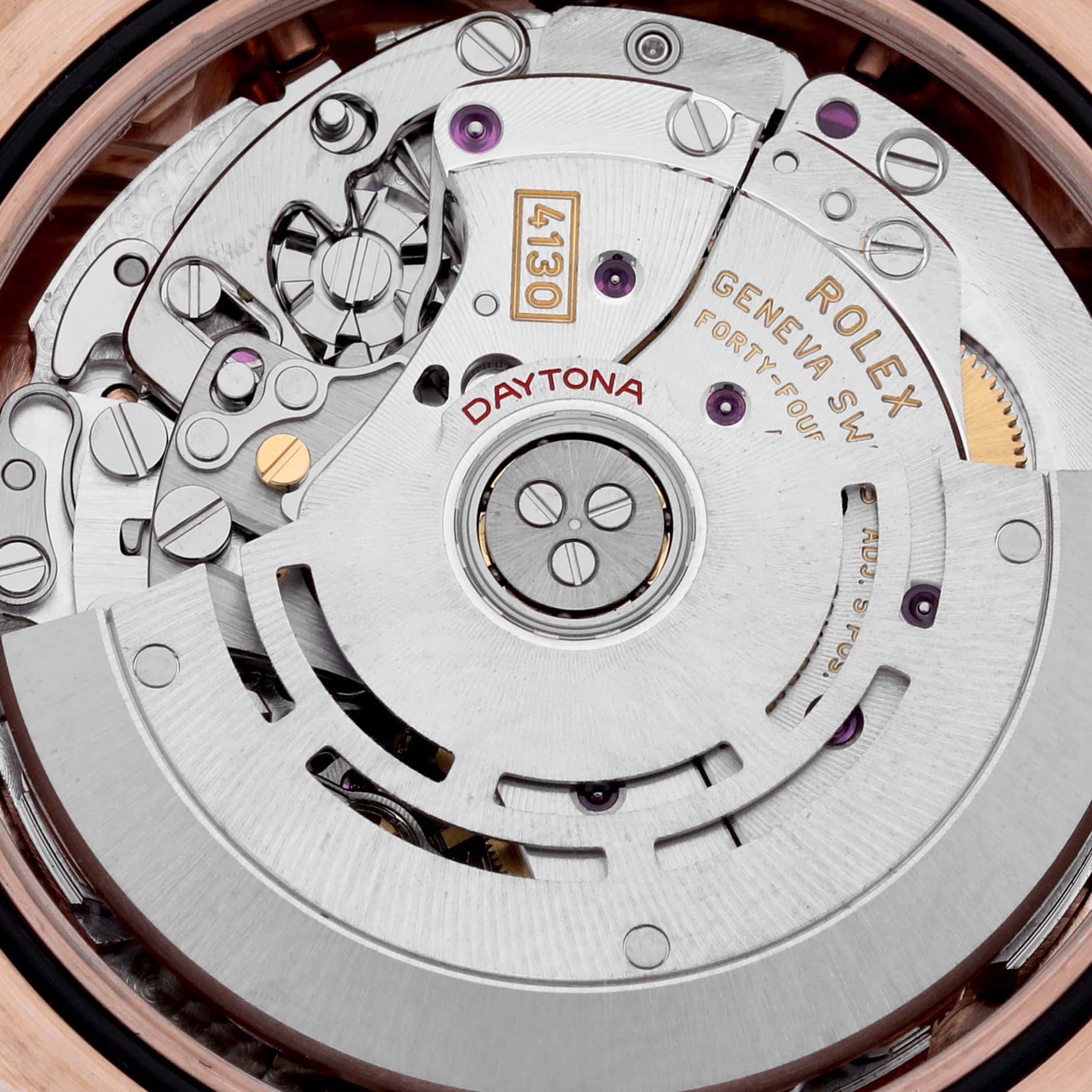This image shows the interior mechanical movement of a Rolex Daytona 116505 Men
s Rose Gold Pink Dial 116505 Men
s Rose Gold Pink Dial watch, focusing on the intricate details of its components.