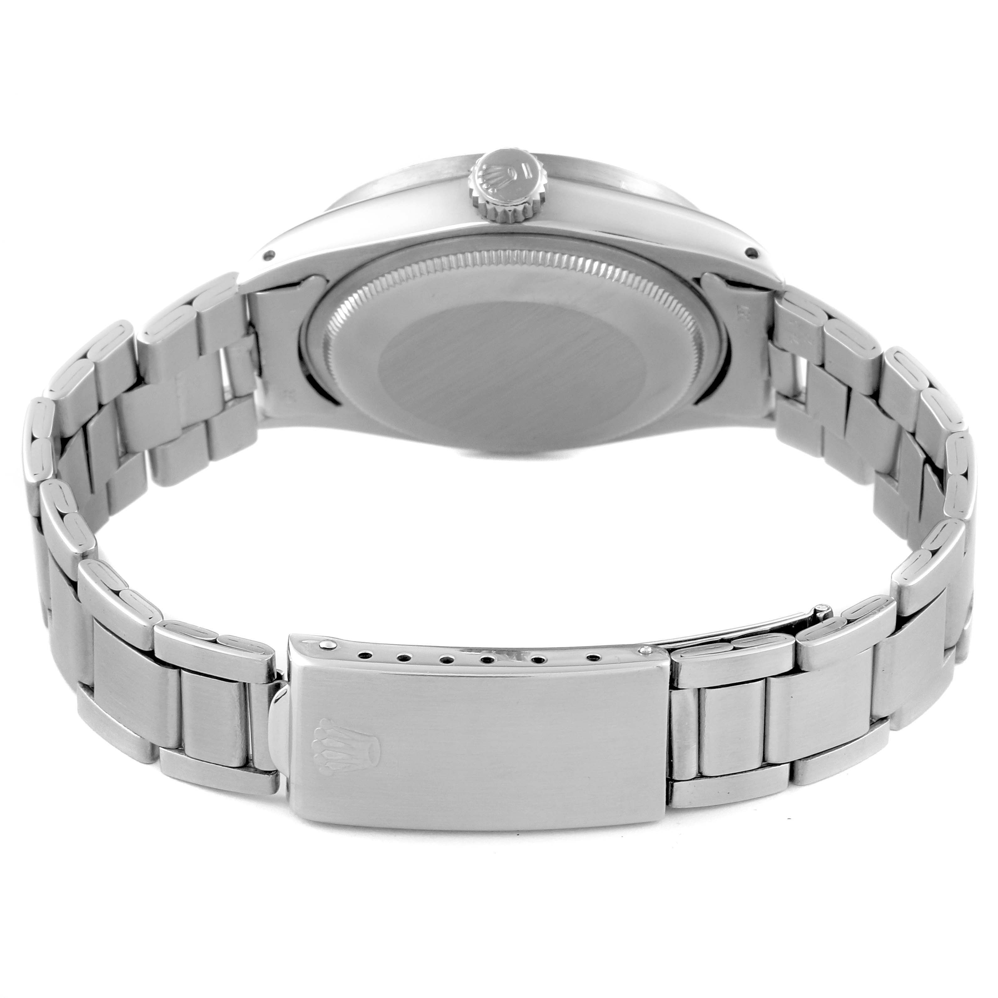 This image shows the back of a Rolex Date 1501 Men's Stainless Steel Champagne Dial 1501 Men's Stainless Steel Champagne Dial model watch, highlighting its bracelet, clasp, and case back.