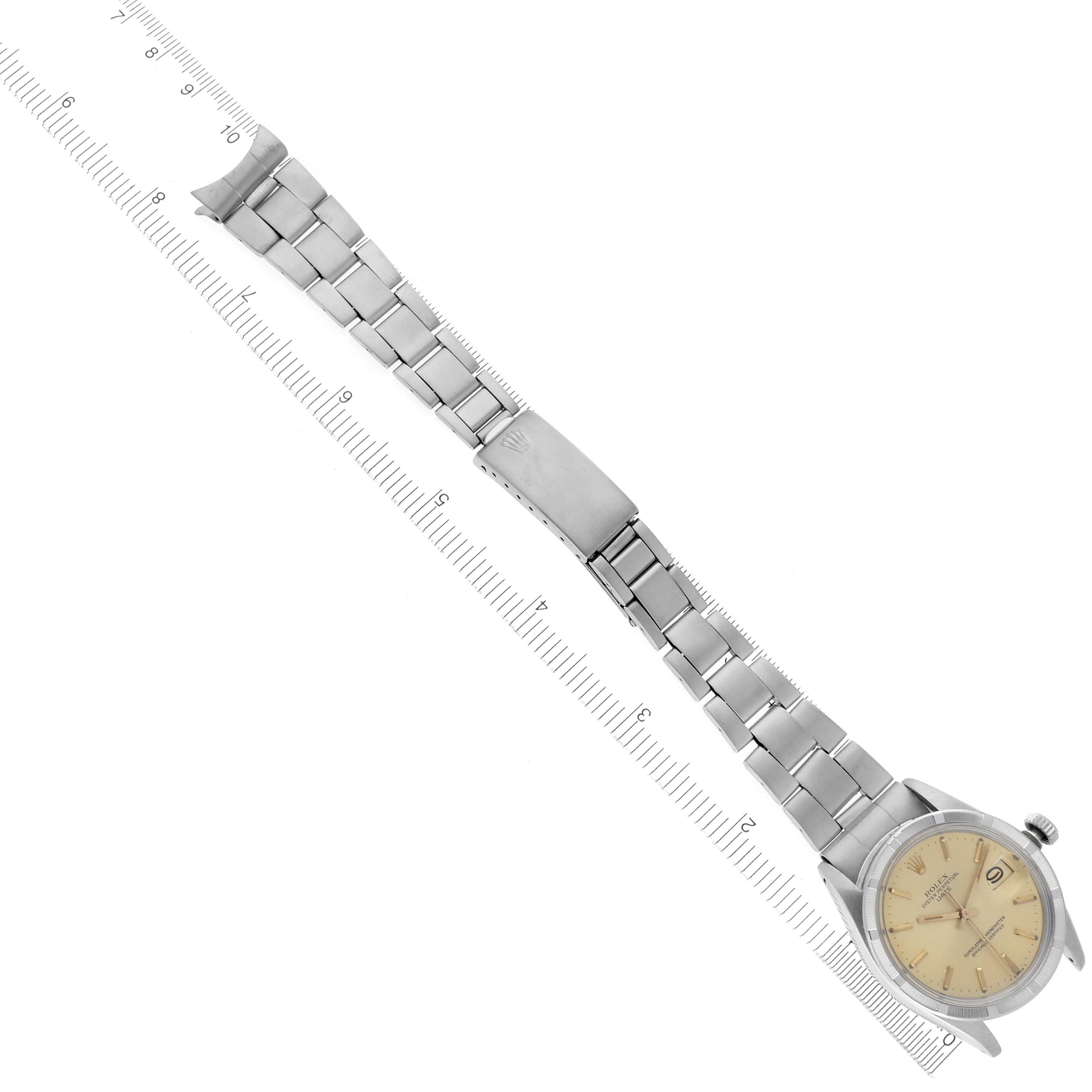 The image shows a Rolex Date 1501 Men's Stainless Steel Champagne Dial 1501 Men's Stainless Steel Champagne Dial model watch laid flat, displaying the full bracelet and the face, with a ruler for size reference.