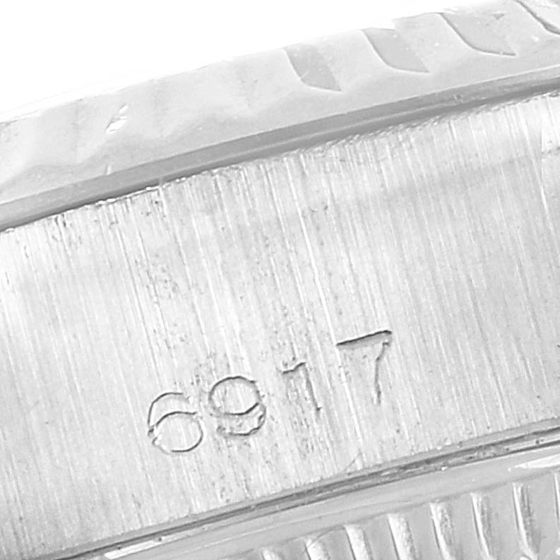 This image shows a close-up view of the side of the case with the model number "6917" engraved on a Rolex Date 6917 Women's Stainless Steel Silver Dial 6917 Women's Stainless Steel Silver Dial watch.