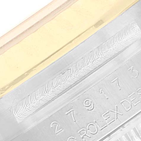 The image shows a close-up of the side of a Rolex Datejust 279173 Women's Steel and Gold (two tone) Champagne Dial 279173 Women's Steel and Gold (two tone) Champagne Dial watch, focusing on the serial number and part of the bezel.