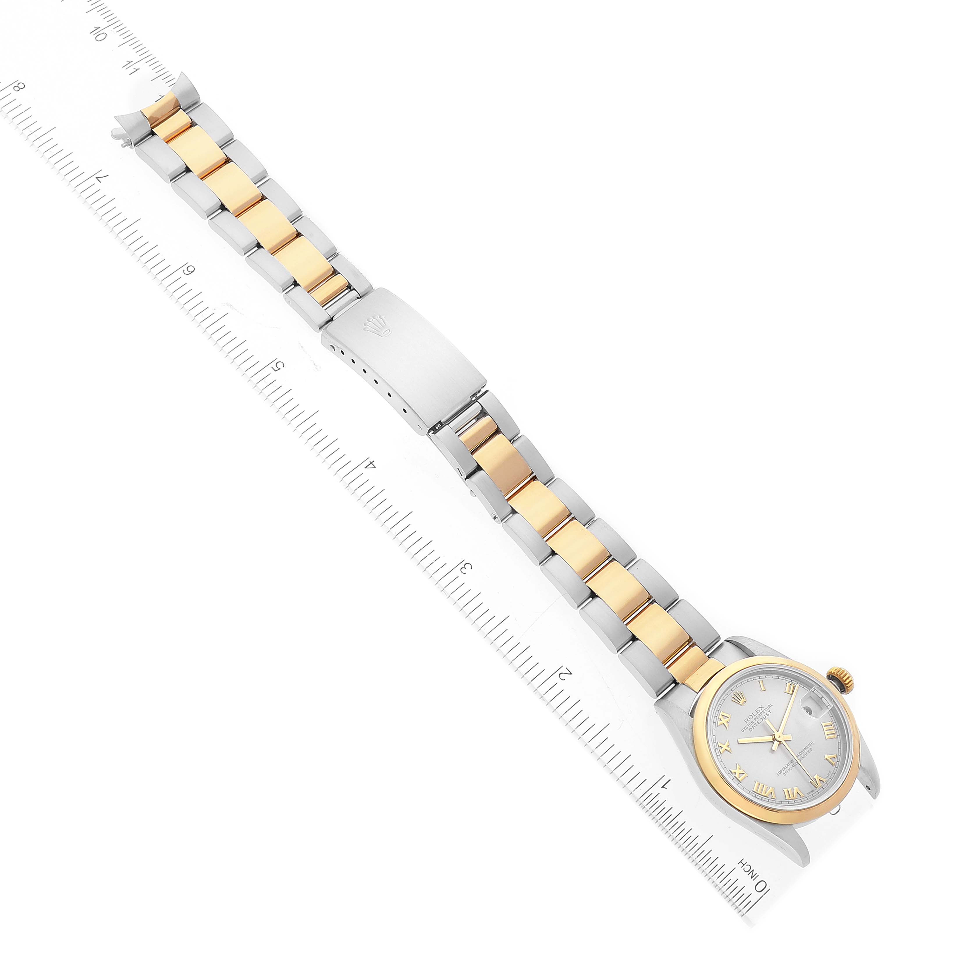 The image shows a top view of a Rolex Mid-Size 78243 Women's Steel and Gold (two tone) Grey Dial 78243 Women's Steel and Gold (two tone) Grey Dial watch, displaying the bracelet, clasp, watch case, and dial with a ruler for scale.