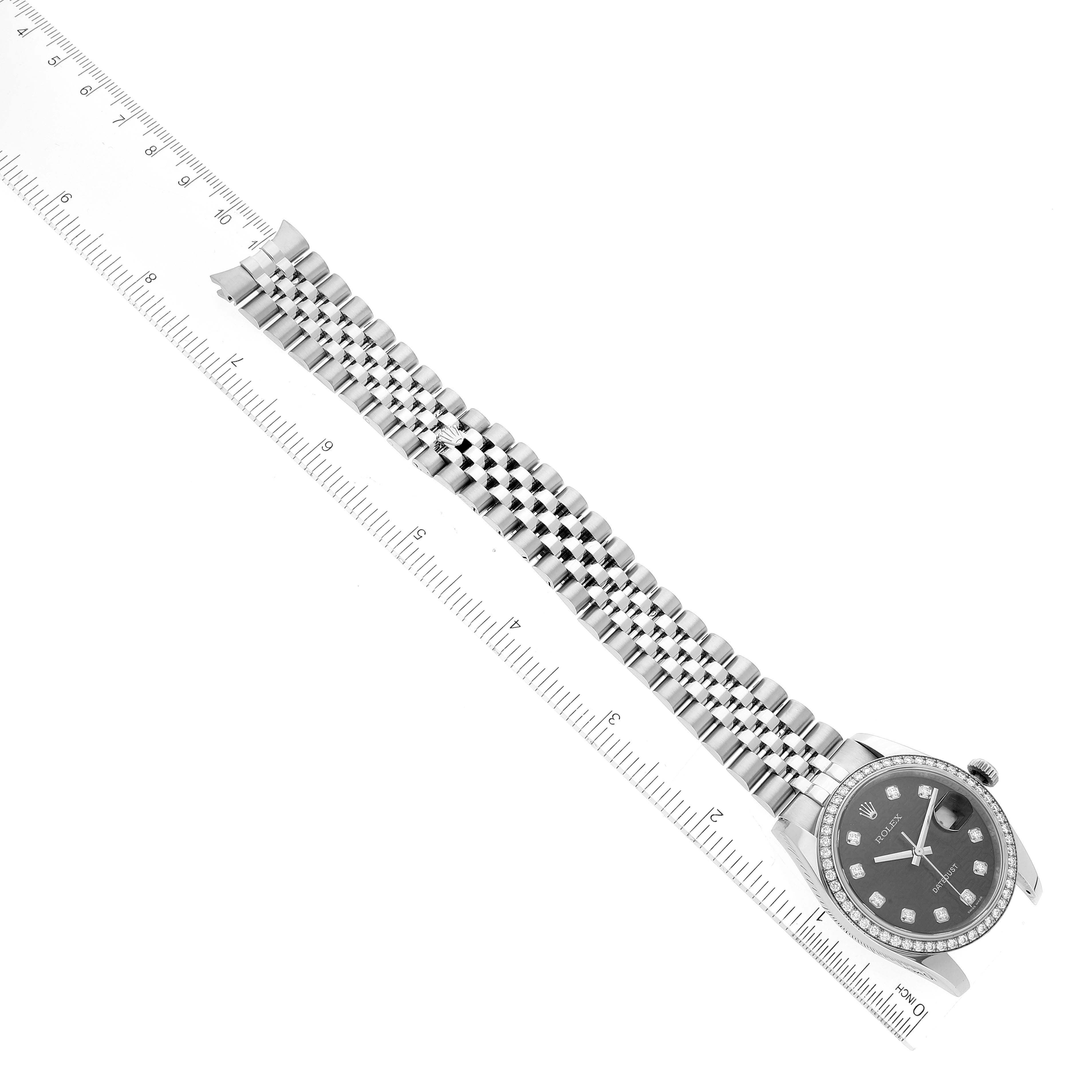 The image shows a Rolex Datejust 116244 Men's Stainless Steel Black Dial 116244 Men's Stainless Steel Black Dial watch viewed from an angled top-down perspective alongside a ruler, highlighting the bracelet.